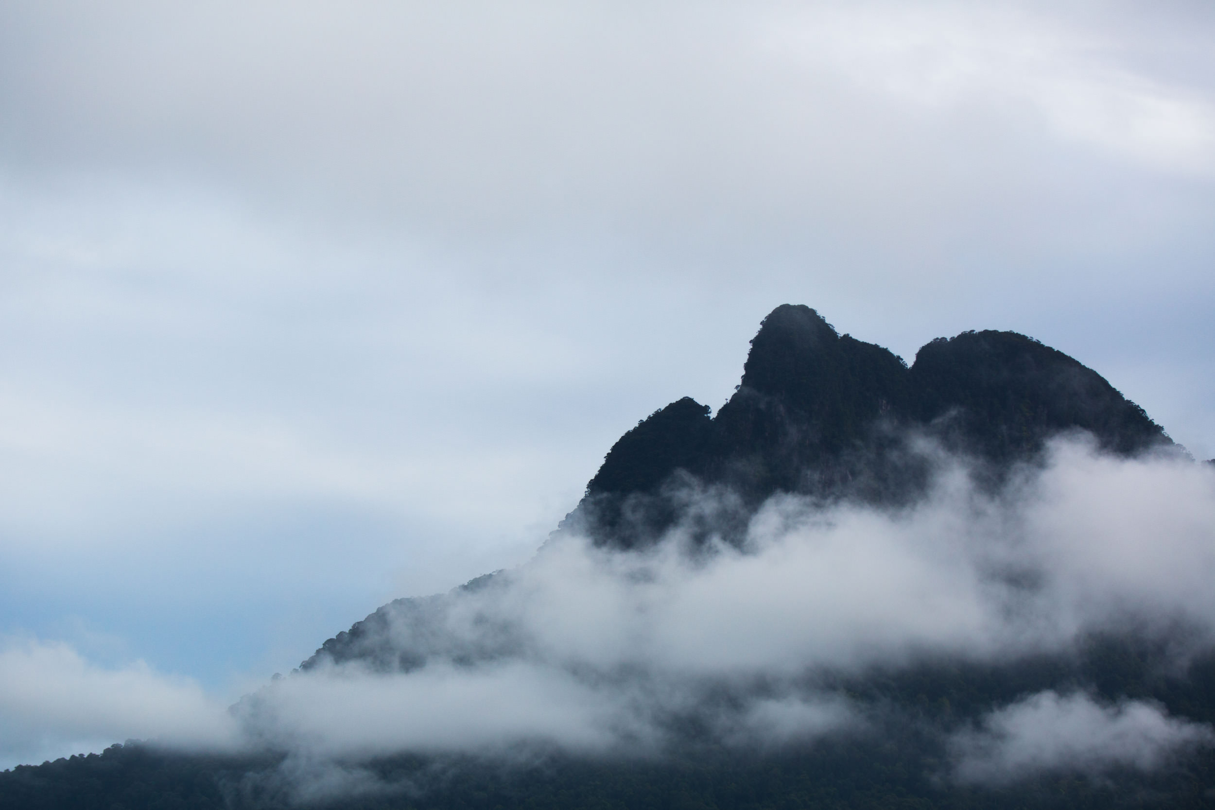  Rocky summits poke their heads through the low cloud. 