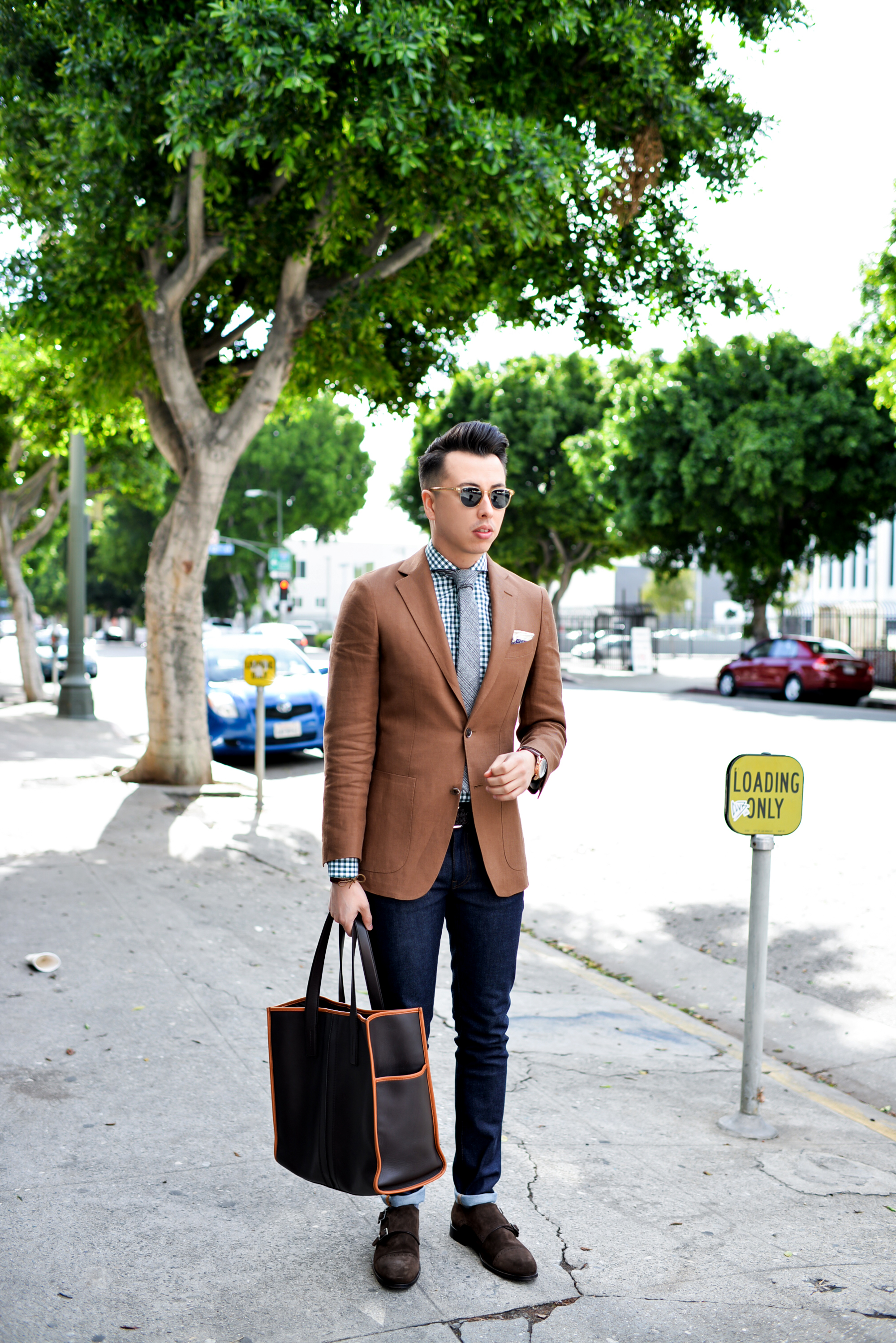 Scott is notorious for his blazer, tie, and slim denim combination that never fails.
