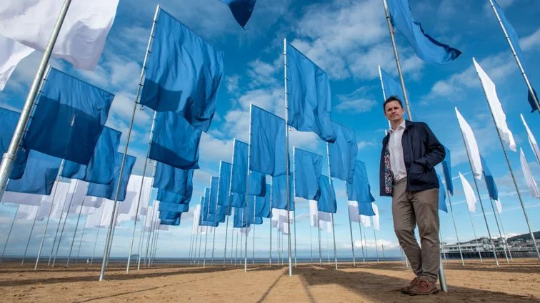 Artist Luke Jerram with his 'In Memoriam' art installation on Weston Beach.