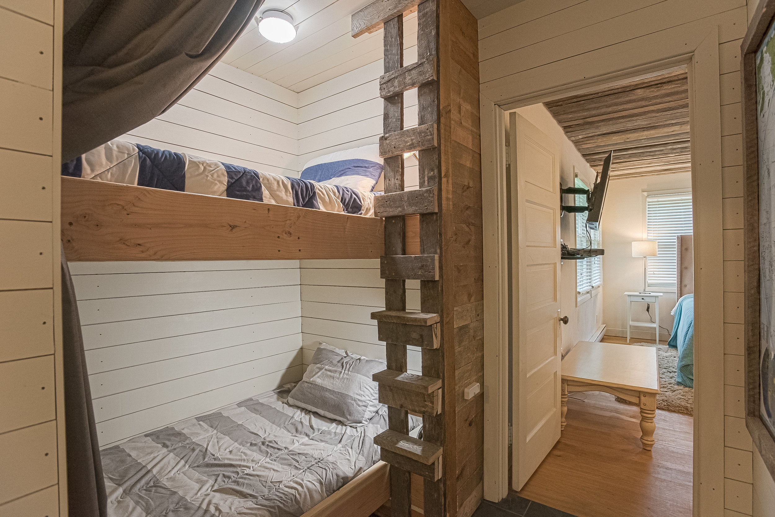 Main House memory foam bunks built for adults or kids include personal storage, lights and fans, privacy curtains and outlets for your favorite electronics. Great for kids whose parents are just a step away in one of the bedrooms or for single adults who want a comfy spot to call home.