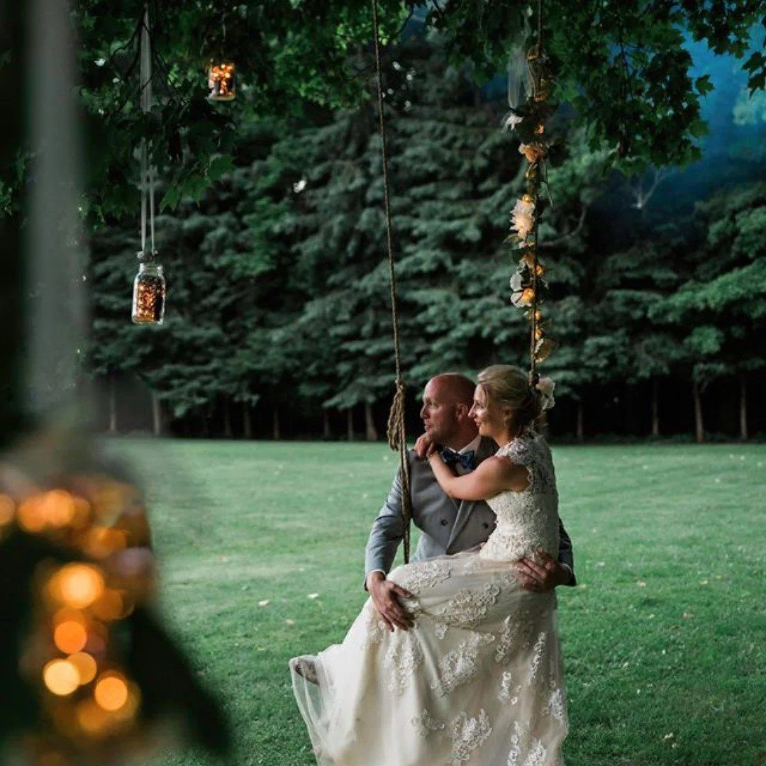 Jenna and Joe swinging from the old maple tree at Sugarcrest.  #sugarcrest, #lakewedding, #jennaandjoewedding, #treeswing, #vacationrental,