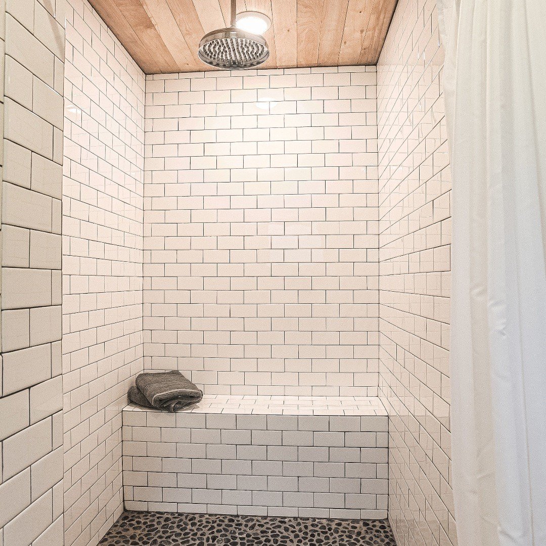 Main house master shower at Sugarcrest.  #sugarcrest, #subwaytile, #vacationrental, #reclaimedwoodceiling, #minnesotavacation, #lakehouserental