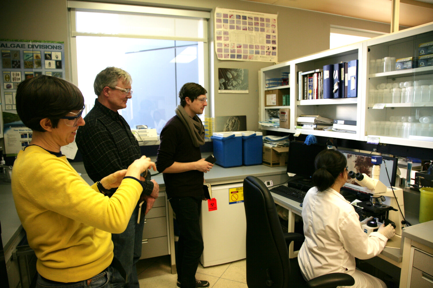  DE Lab Artists Becky Shaw, Peter von Tiesenhausen, and Steve Gurysh during a visit at the City's Micro-Biology laboratory. 