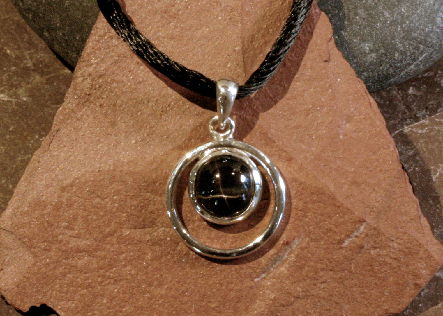 Sterling silver black star sapphire circle pendant