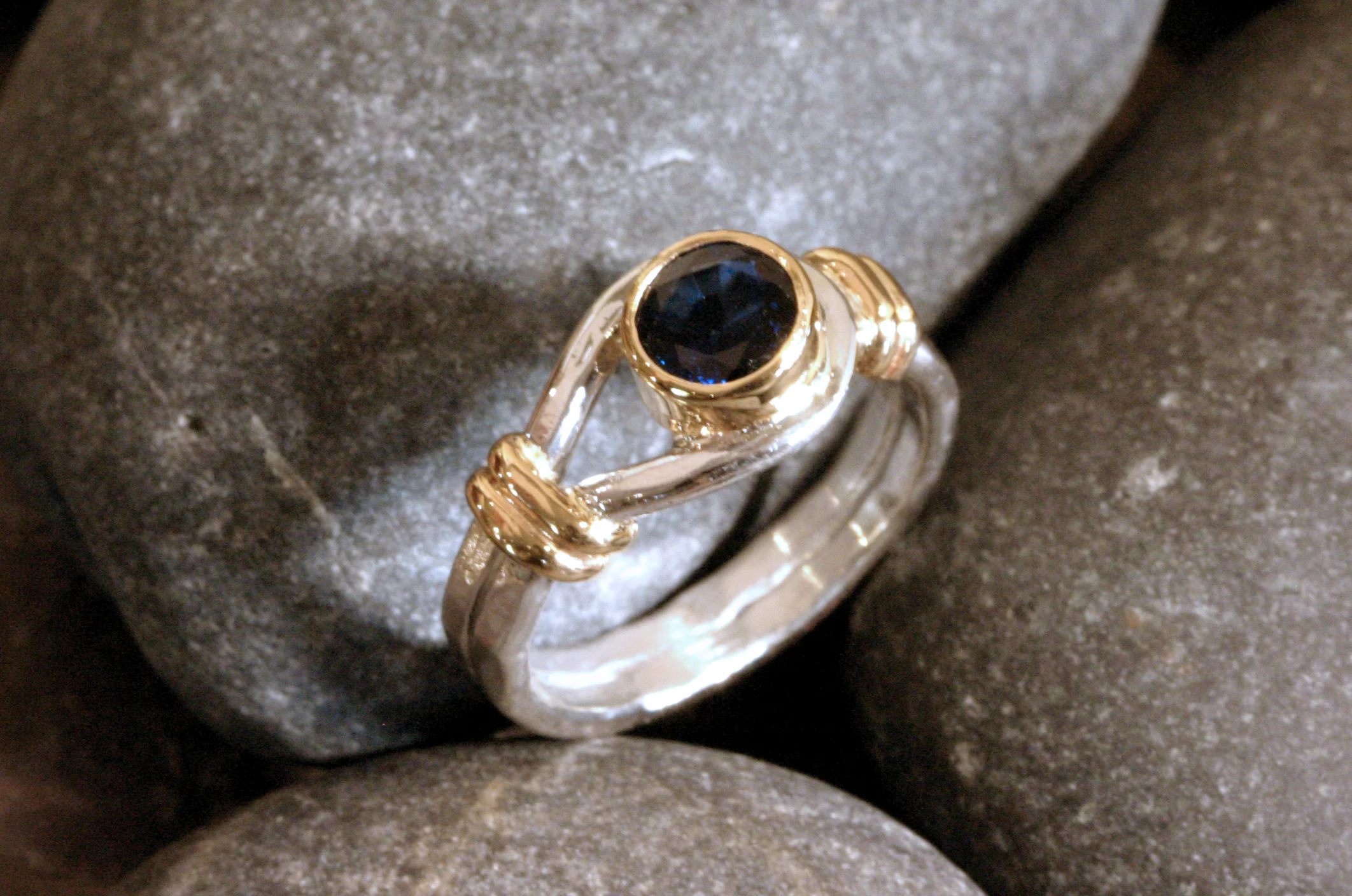 Sterling silver & 14K gold button ring with a bezel set blue sapphire for the button