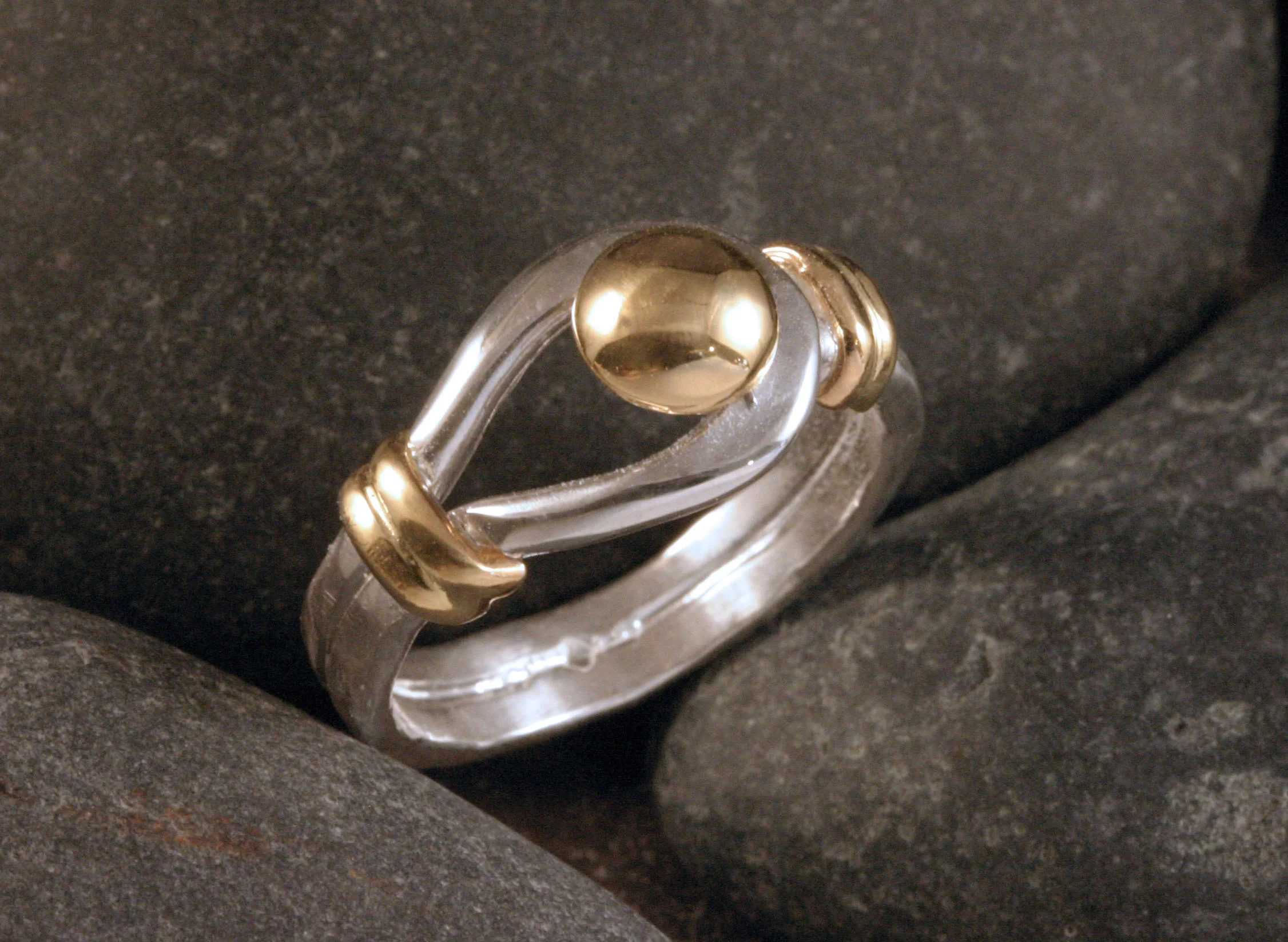 Sterling silver and 14K gold button ring three quarters view.