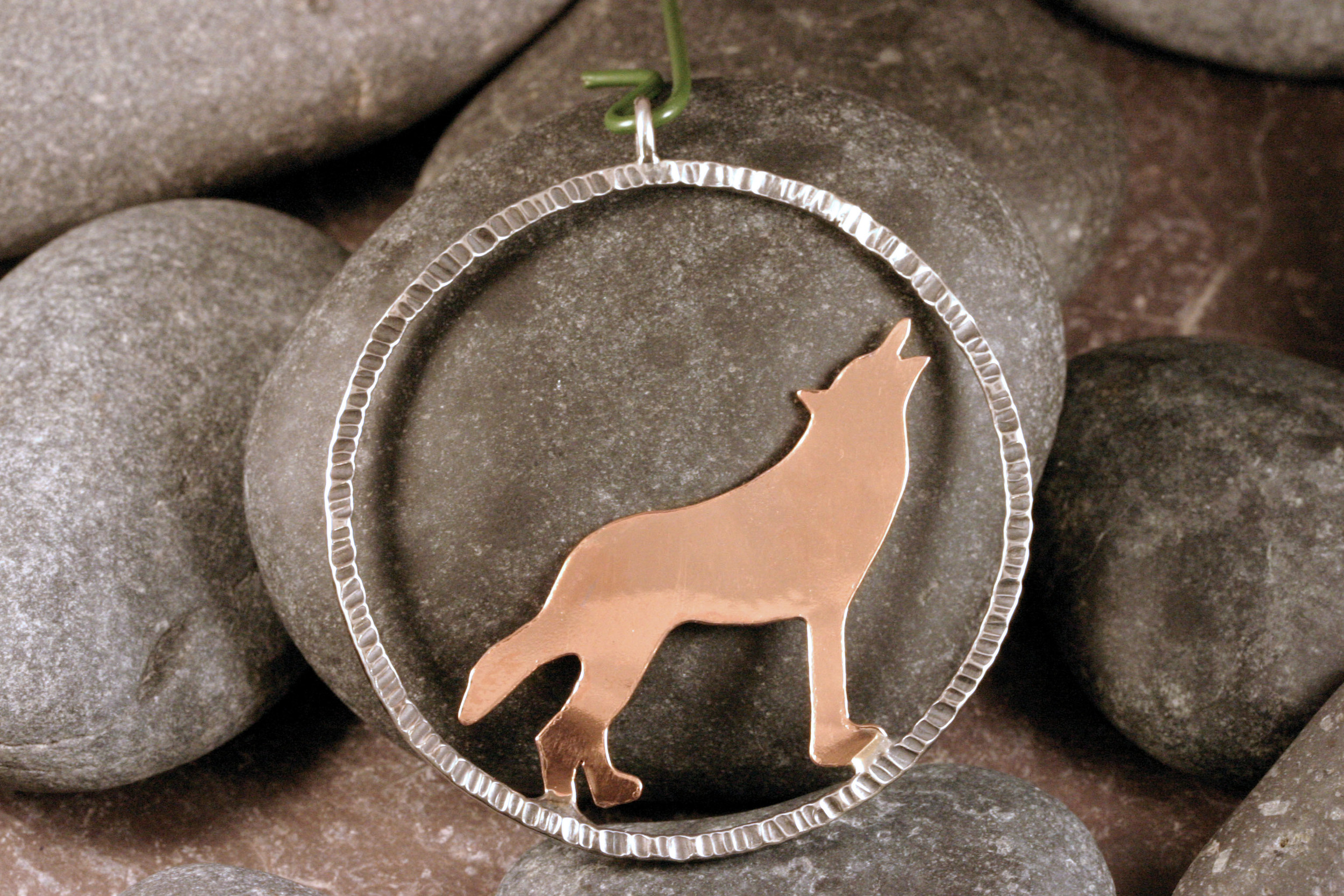 Sterling silver & copper wolf silhouette ornament.