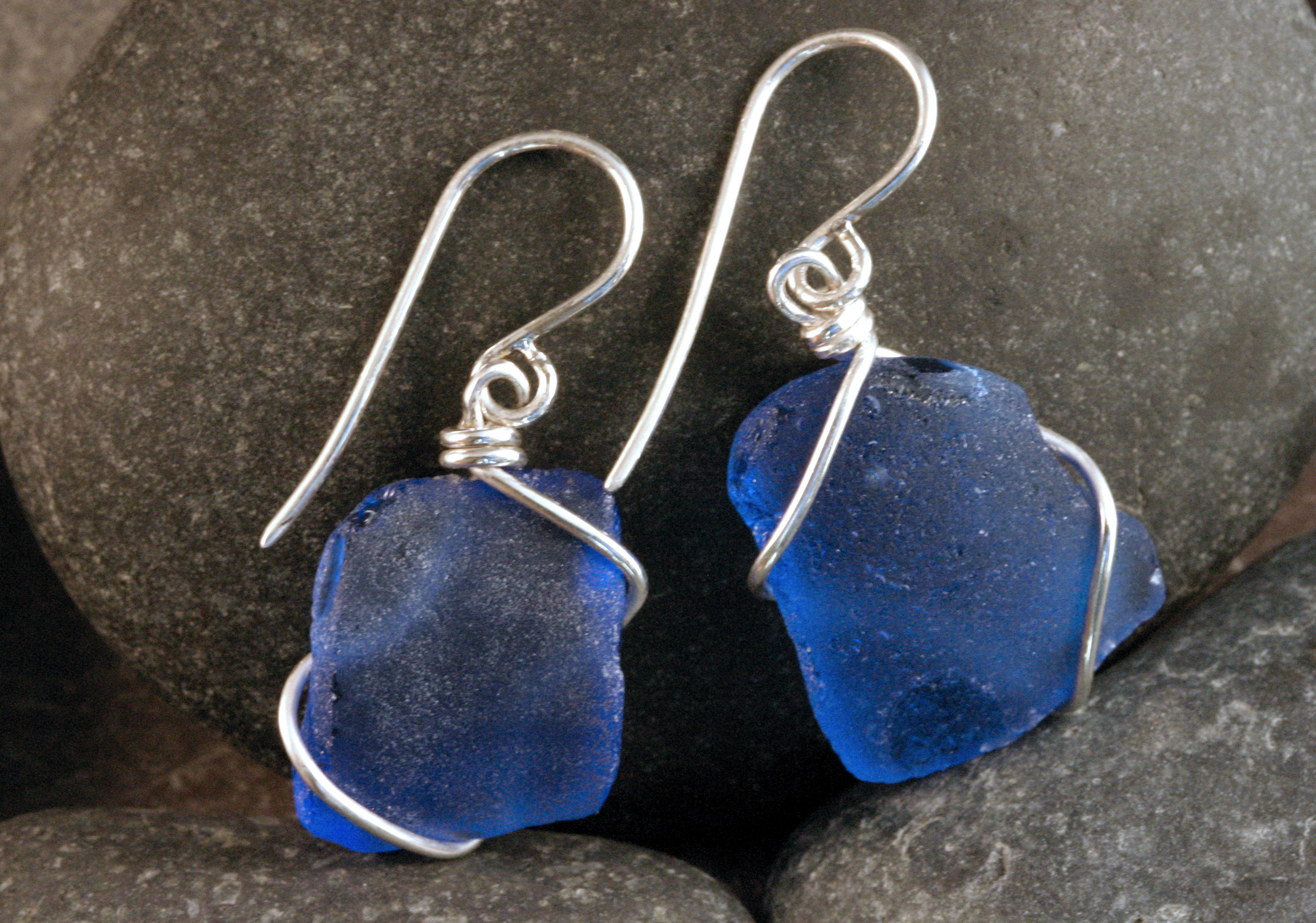 Blue seaglass wire wrapped into sterling silver earrings.