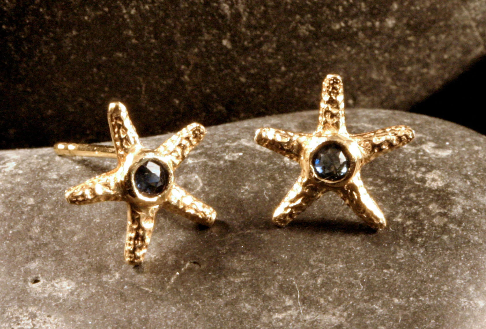 14K gold blue sapphire starfish studs.