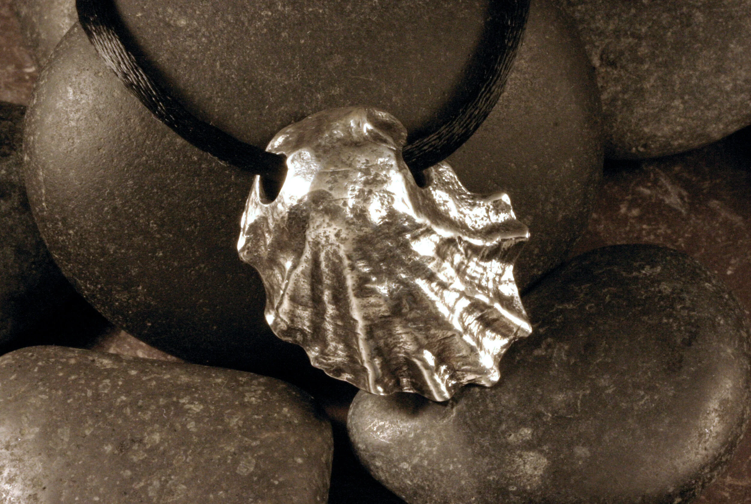 Front view of large vertical oxidized sterling silver Wellfleet oyster seashell slide pendant.