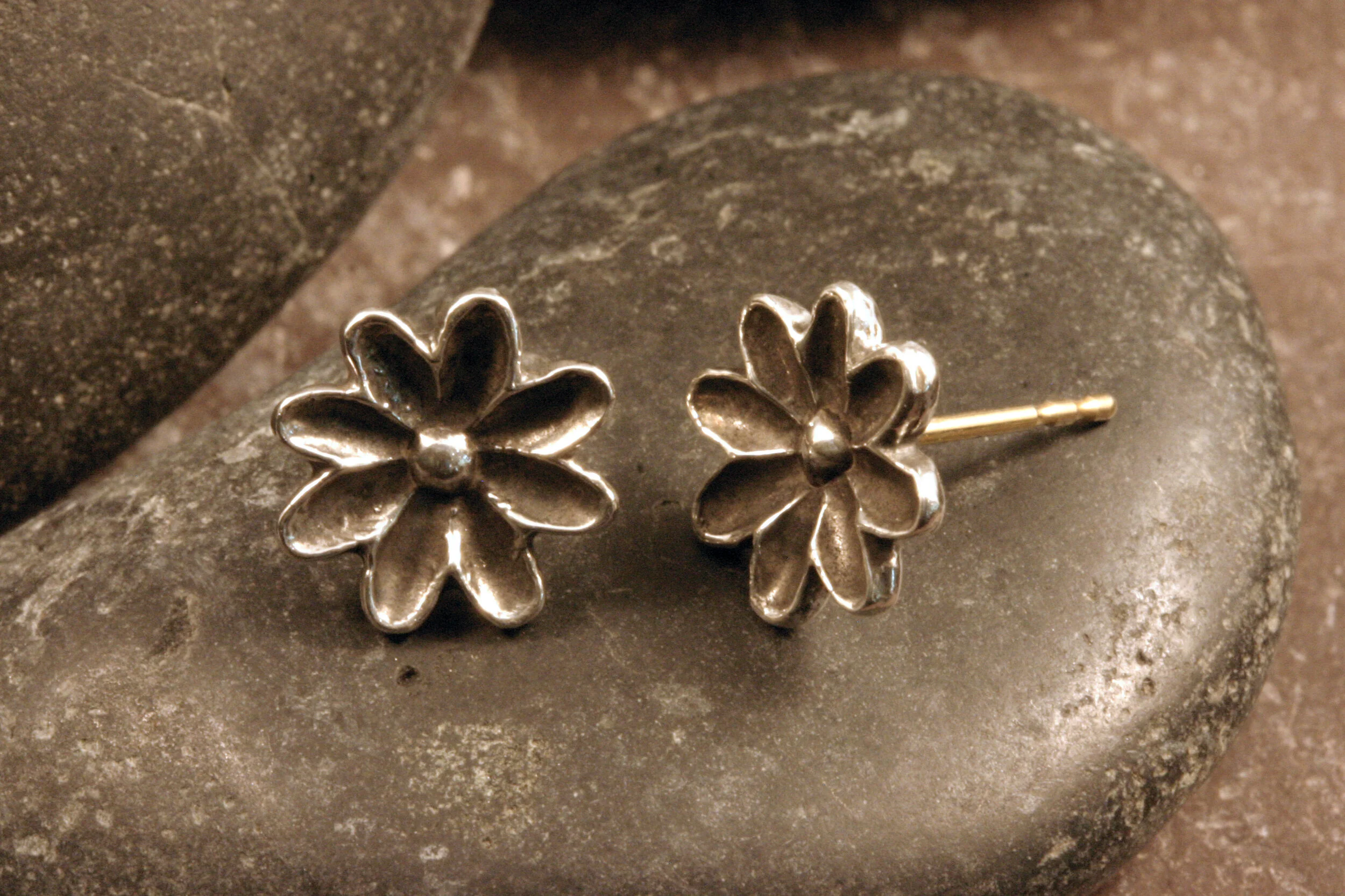Oxidized sterling silver daisy flower studs angled view