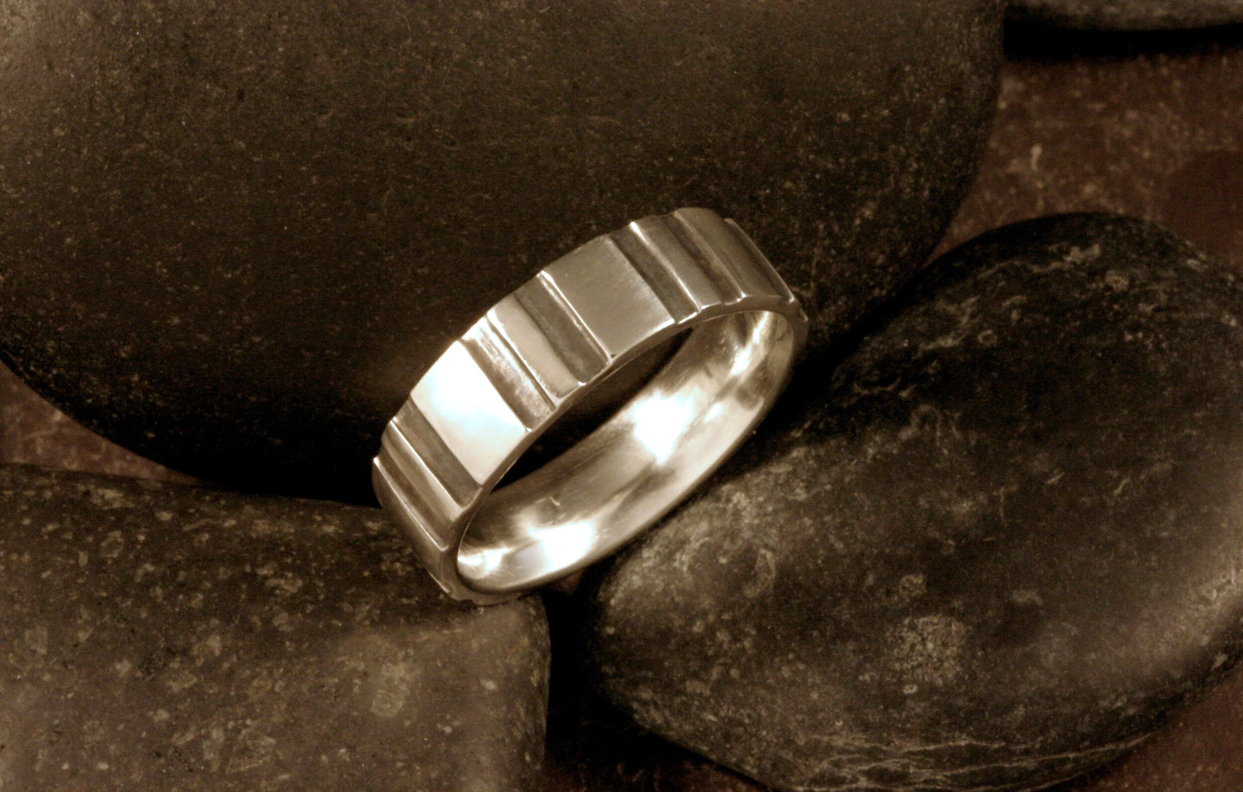 Wide oxidized sterling silver gear ring band.