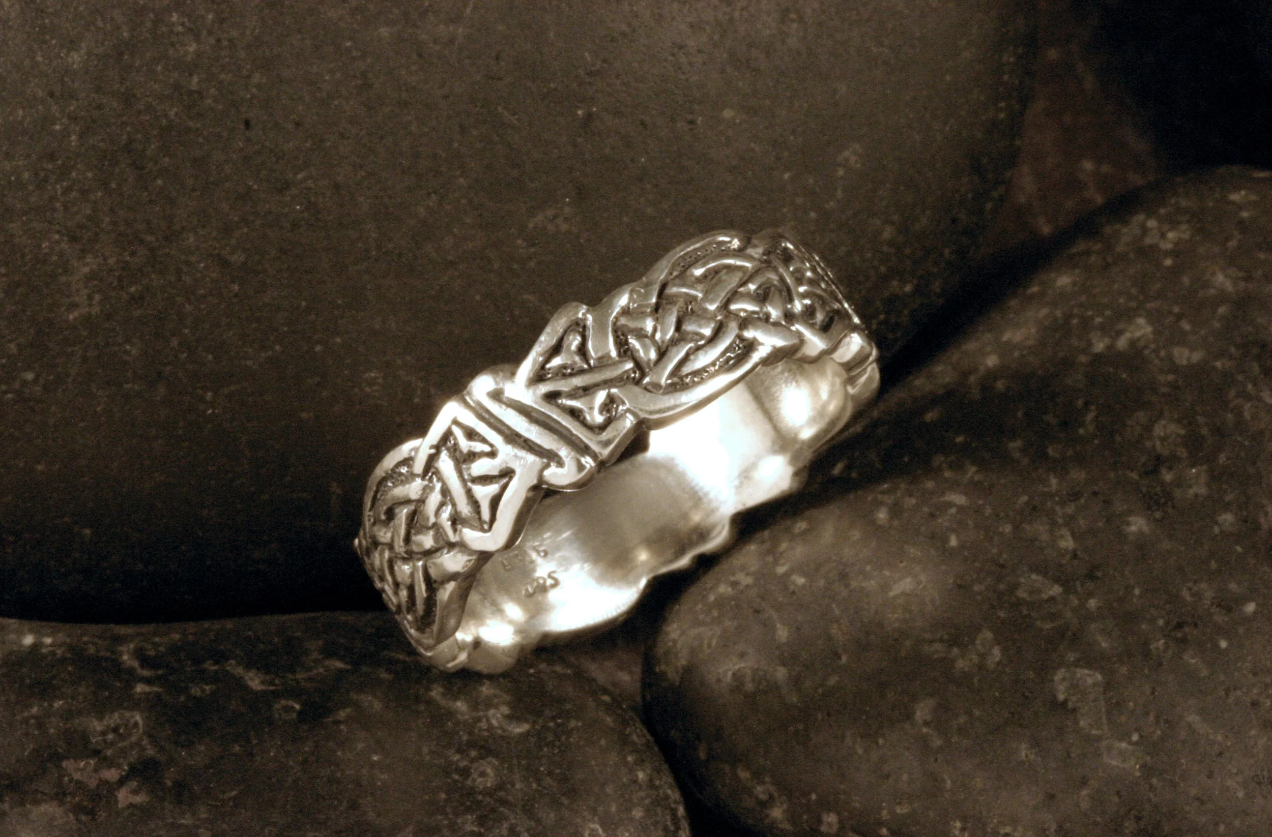 An oxidized sterling silver intricate celtic knot ring.