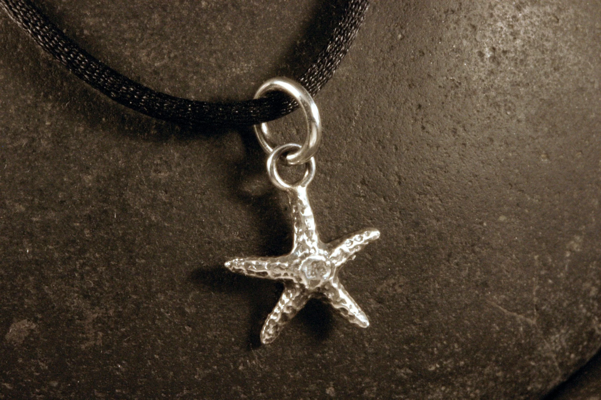 Small oxidized sterling silver starfish charm