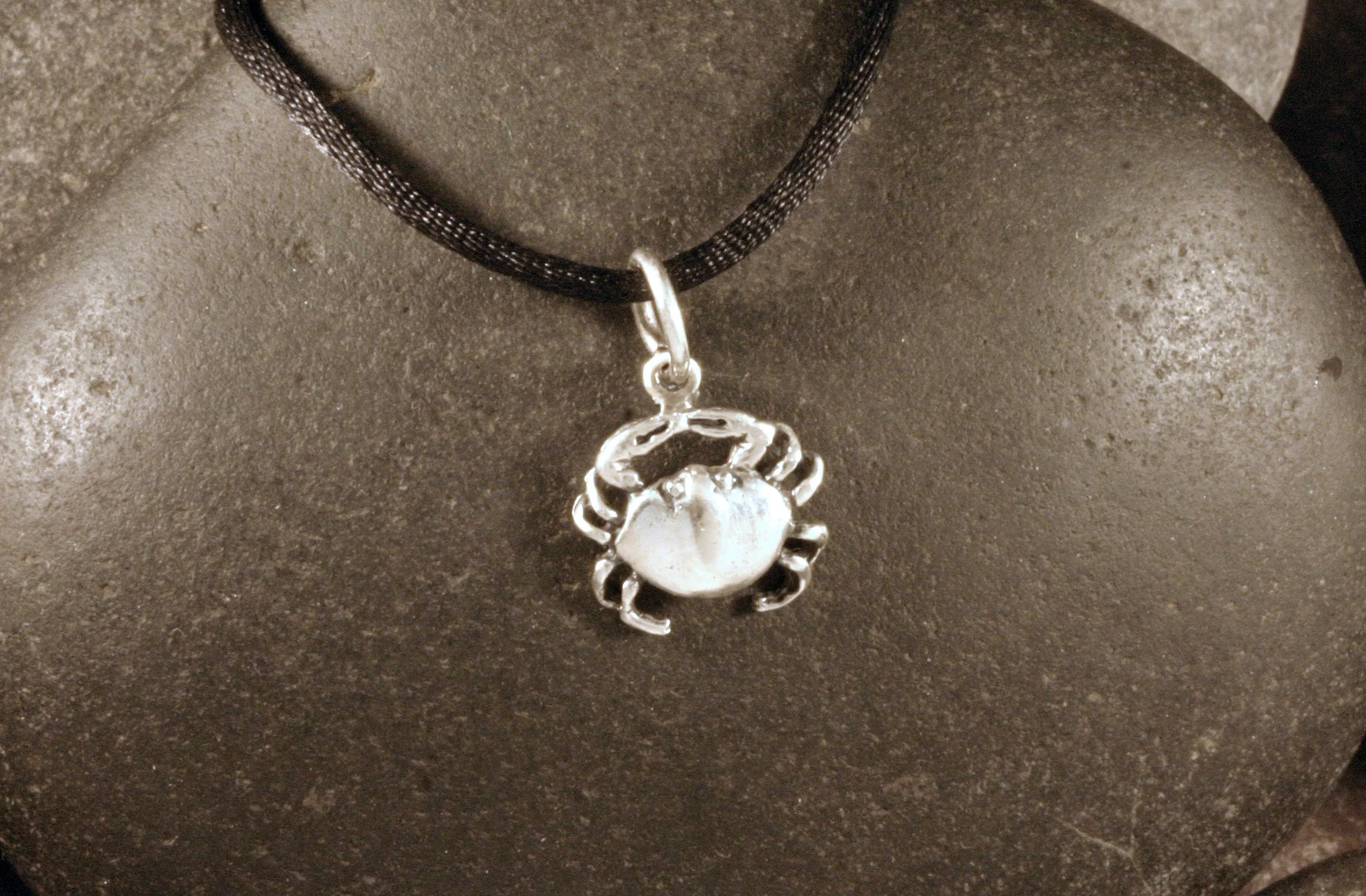 An oxidized sterling silver mini crab charm.