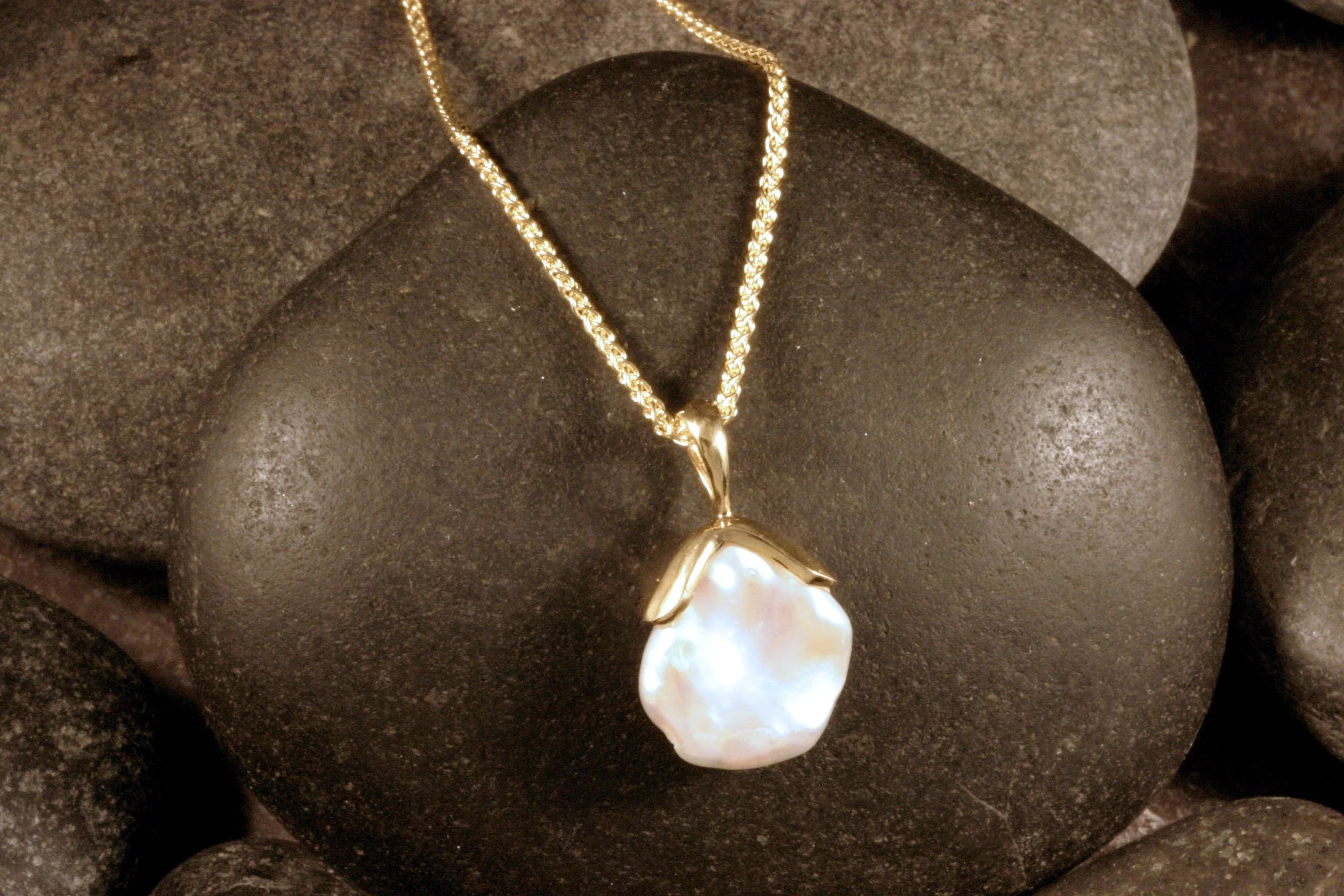 Front view of 14K gold freshwater petal pearl pendant with a bumpy petal pearl.