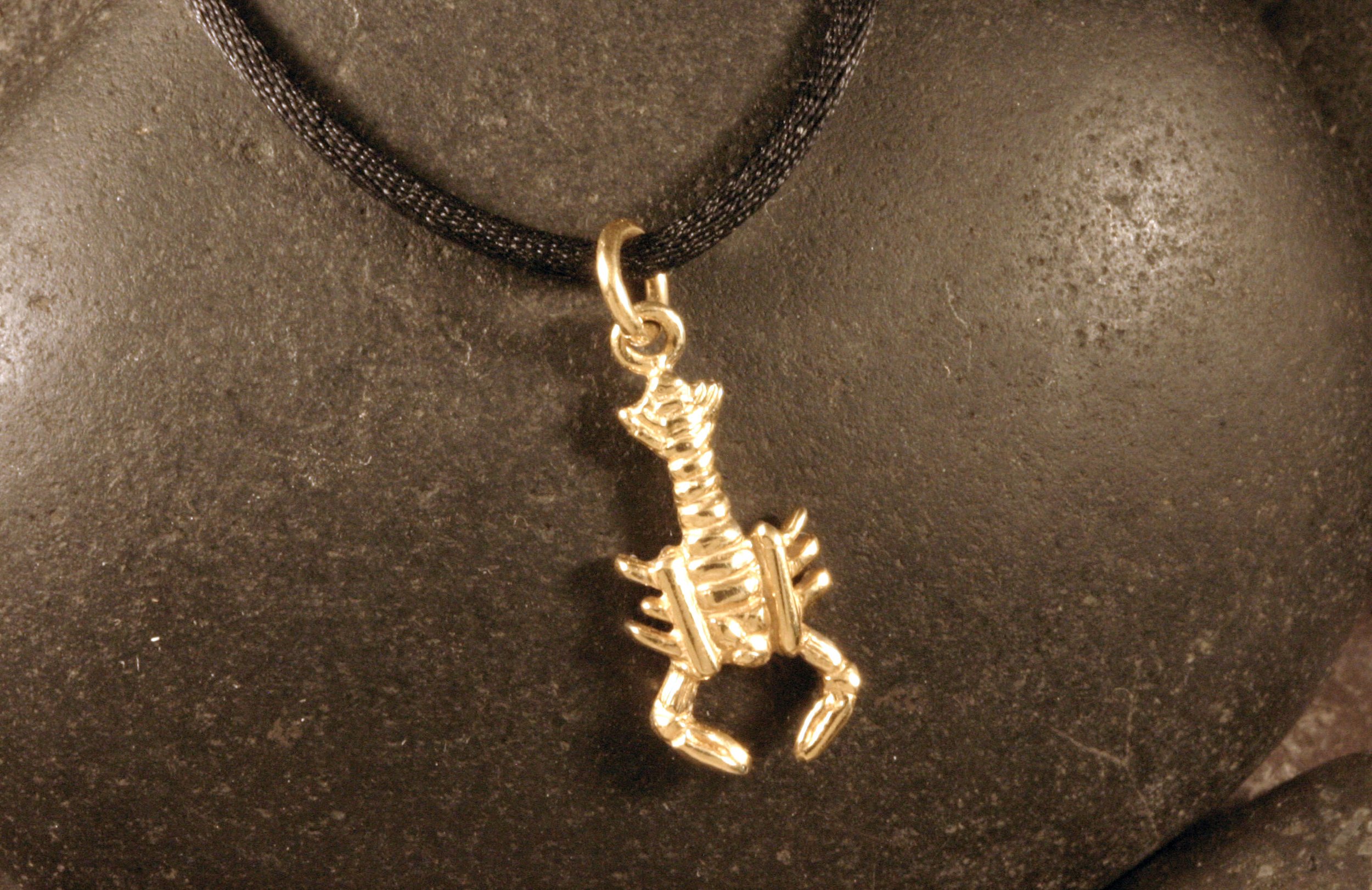 A 14K gold mini lobster charm.