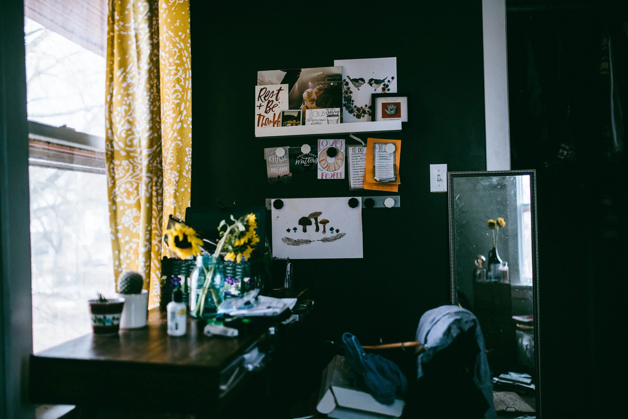 This was a lighting test shot. I almost didn't share it. It's messy. My life is messy right now. I've been rearranging my room and it's not done. But it's my real life: flowers and denim and to-do lists and art. Life and creation and the mess in-between. Here I am.