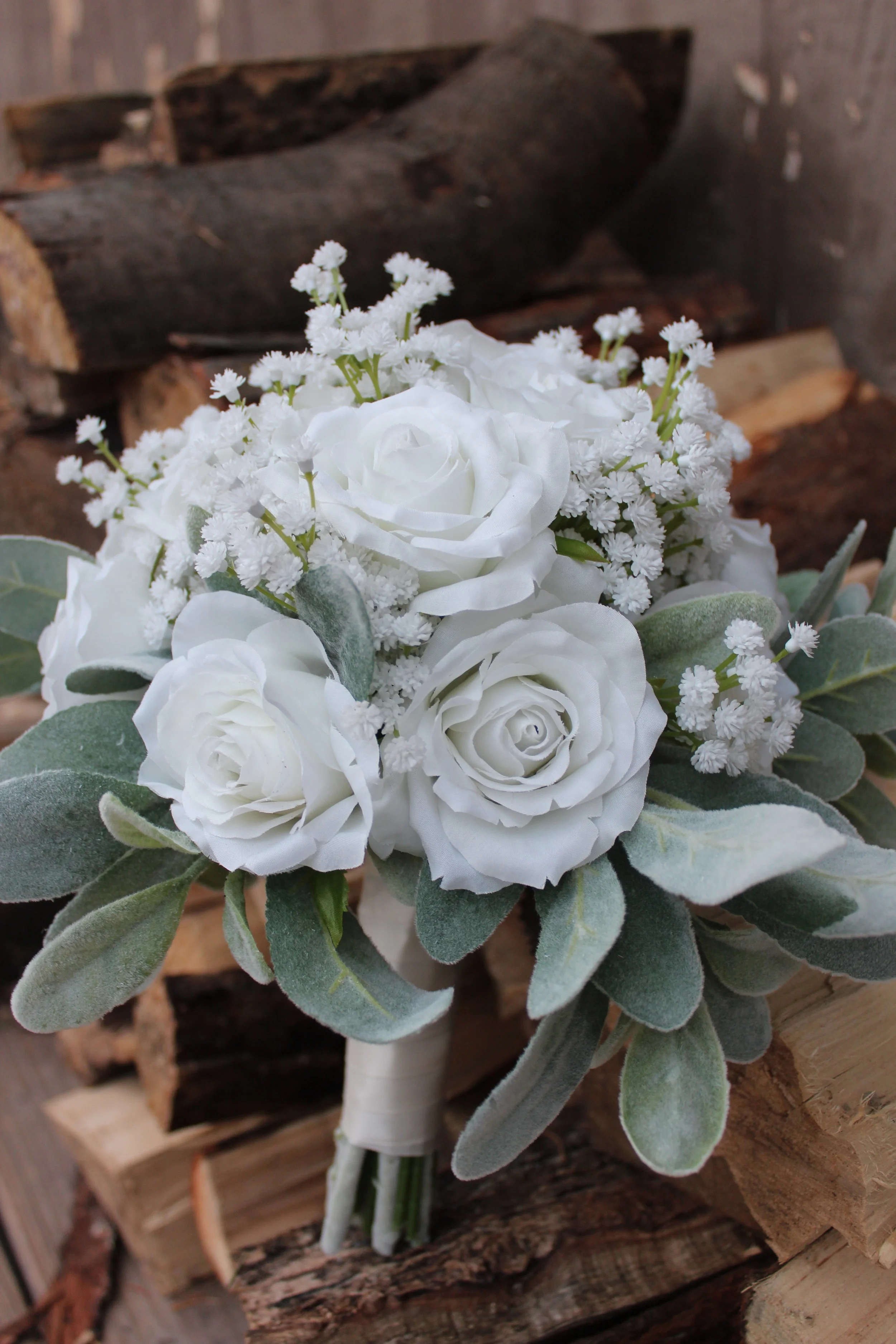 White Roses and Baby's Breath, softened up with Lamb's Ear and Ivory Ribbon