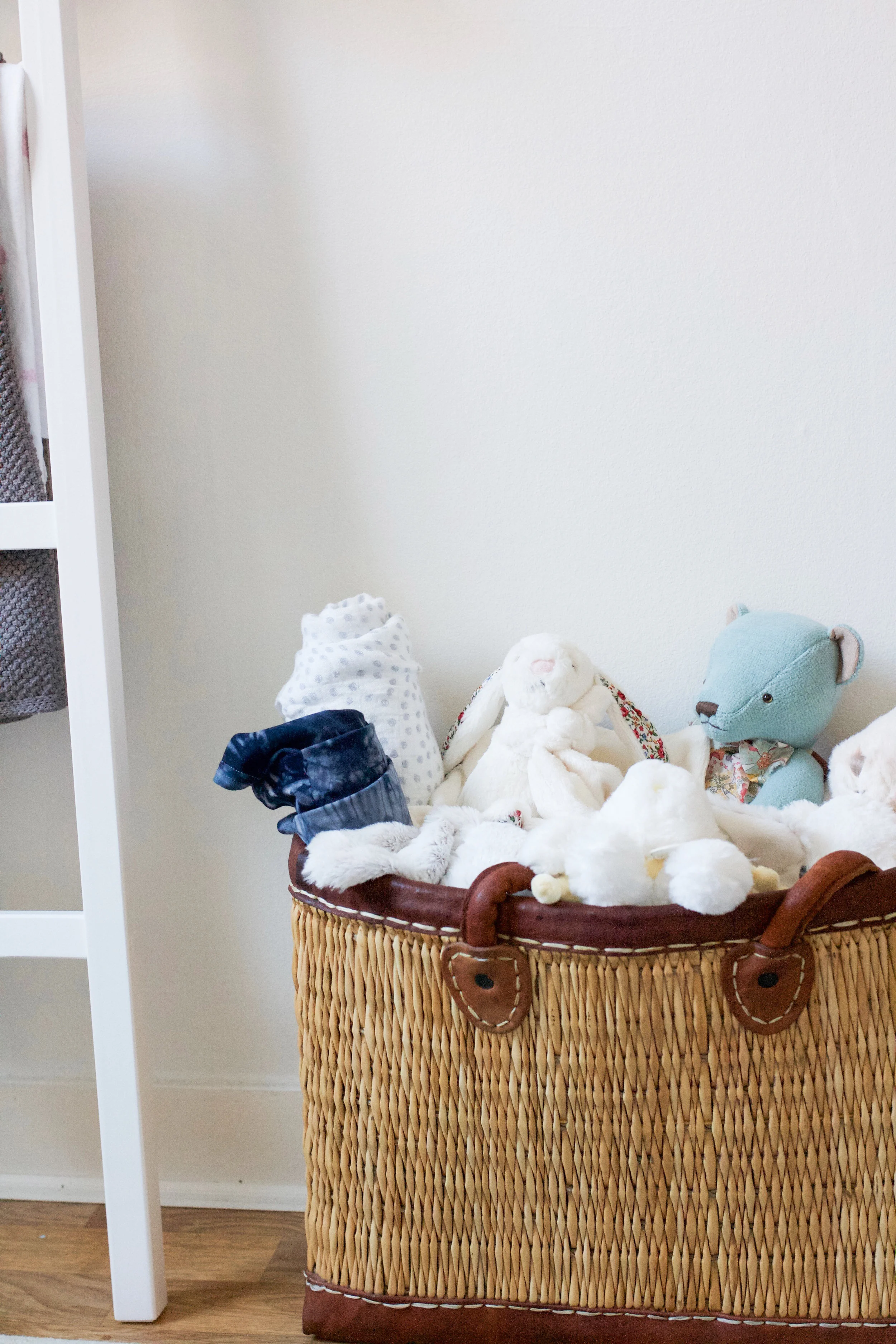 Just a handful of the many “gosedjur” (stuffed animals) we received for Isabella, cozily tucked inside a basket I purchased from the open-air market in Aix-en-Provence, France, where my husband and I met.