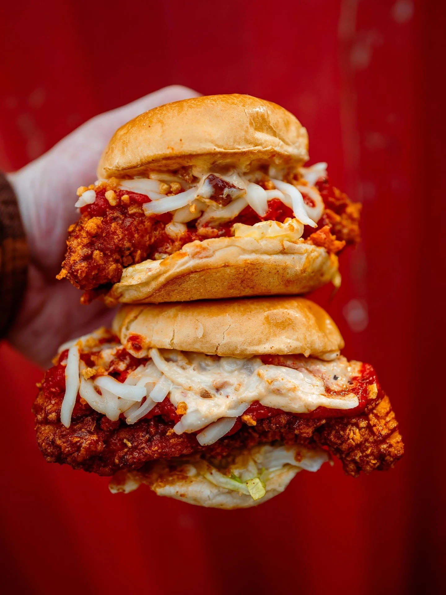 New month, new Sliders to fall in 💕 love 💕 with. Chicken Parmesan Sliders with fried garlic, cherry pepper, mozzarella, shredded lettuce, and marinara. Get them from No Heat to Gonzo and any level you can handle in between. 🔥 

#slidersofthemonth 