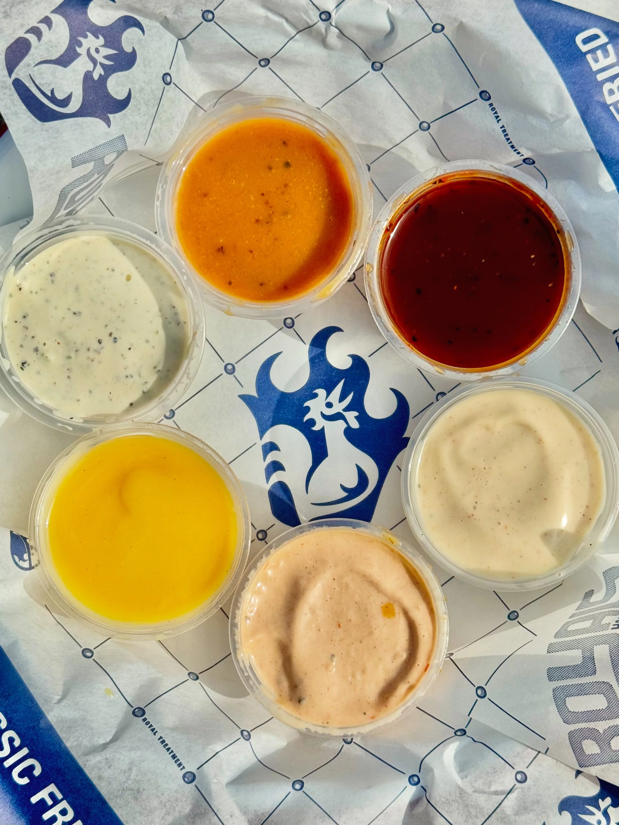 Catch (dip) flights, not feelings.

For $3.50, you can try every dip we have in the kitchen:

&bull; Royals Ranch
&bull; Feast BBQ
&bull; Kentucky Honey Mustard
&bull; Alabama White BBQ
&bull; Mississippi Comeback
&bull; Carolina Gold