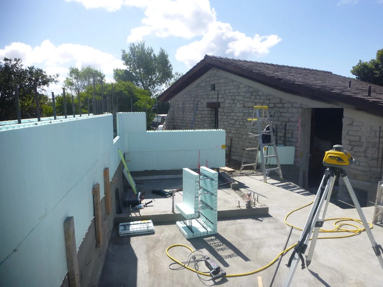 Insulated concrete forms & radiant solar heated floor form the core of this addition
