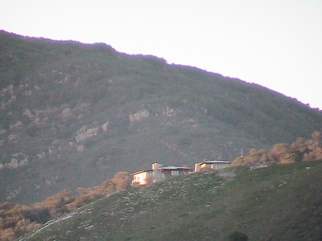 A corrugated metal roof & cellulose insulated 2x6 walls keep the elements out of this backcountry home.