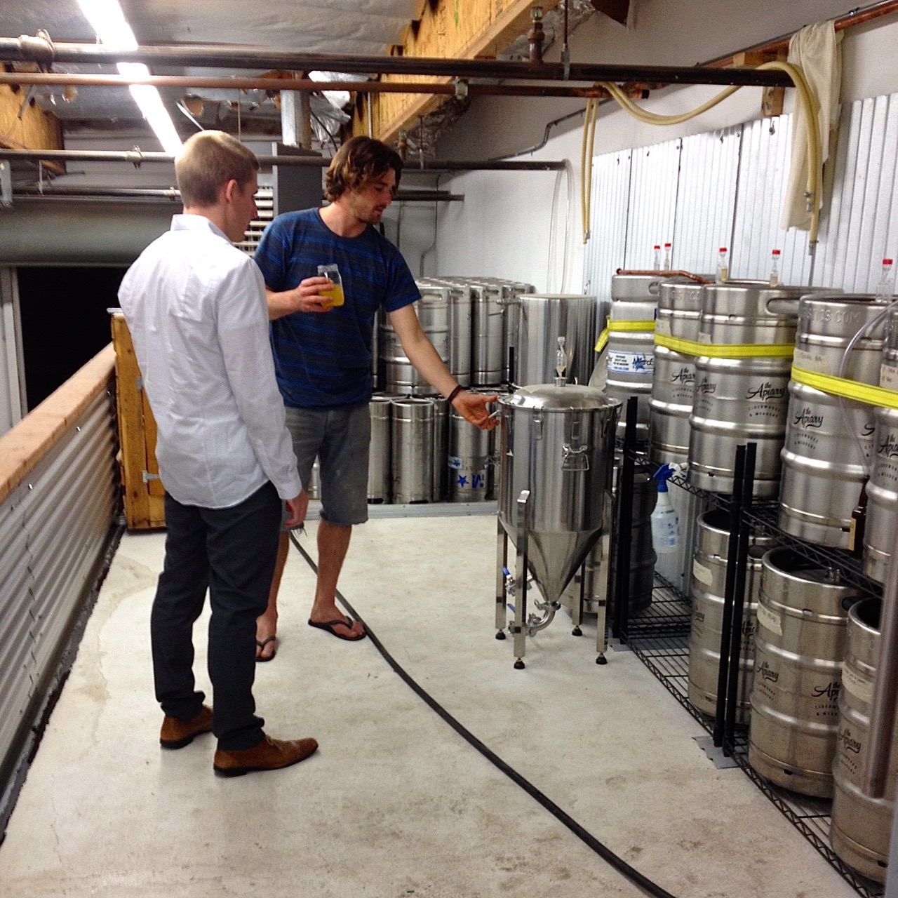 Up and running: Nole shares his brew methods with attorney Brian Daly.