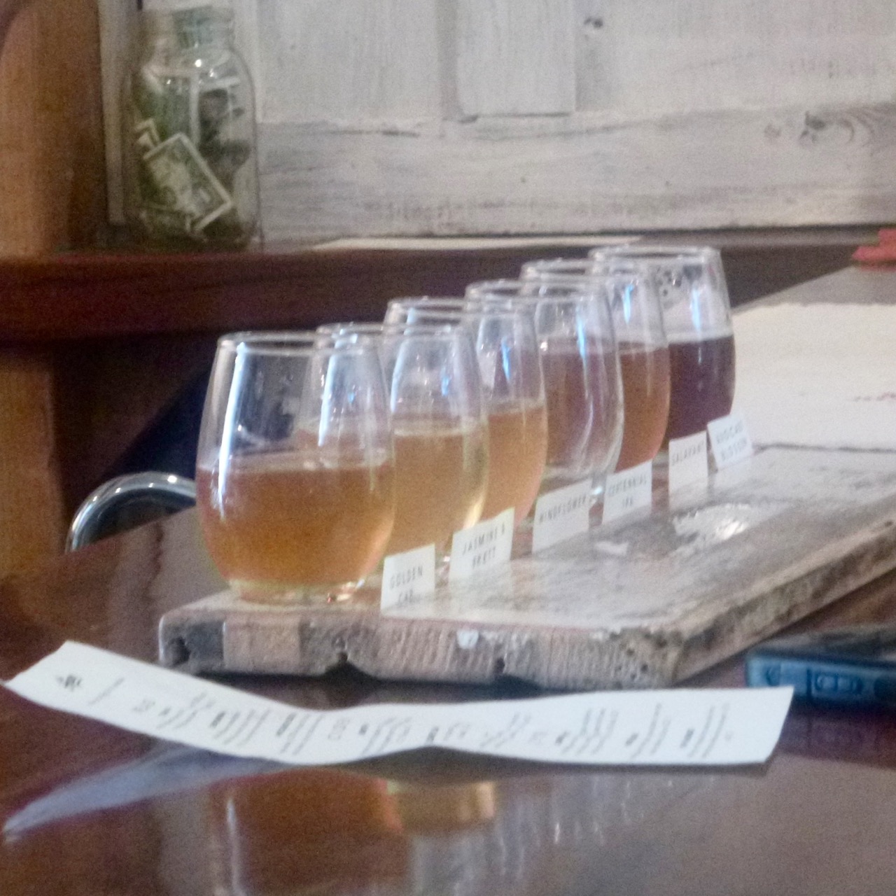  Nine taps: Flights of 6 are served on repurposed bee box parts. 