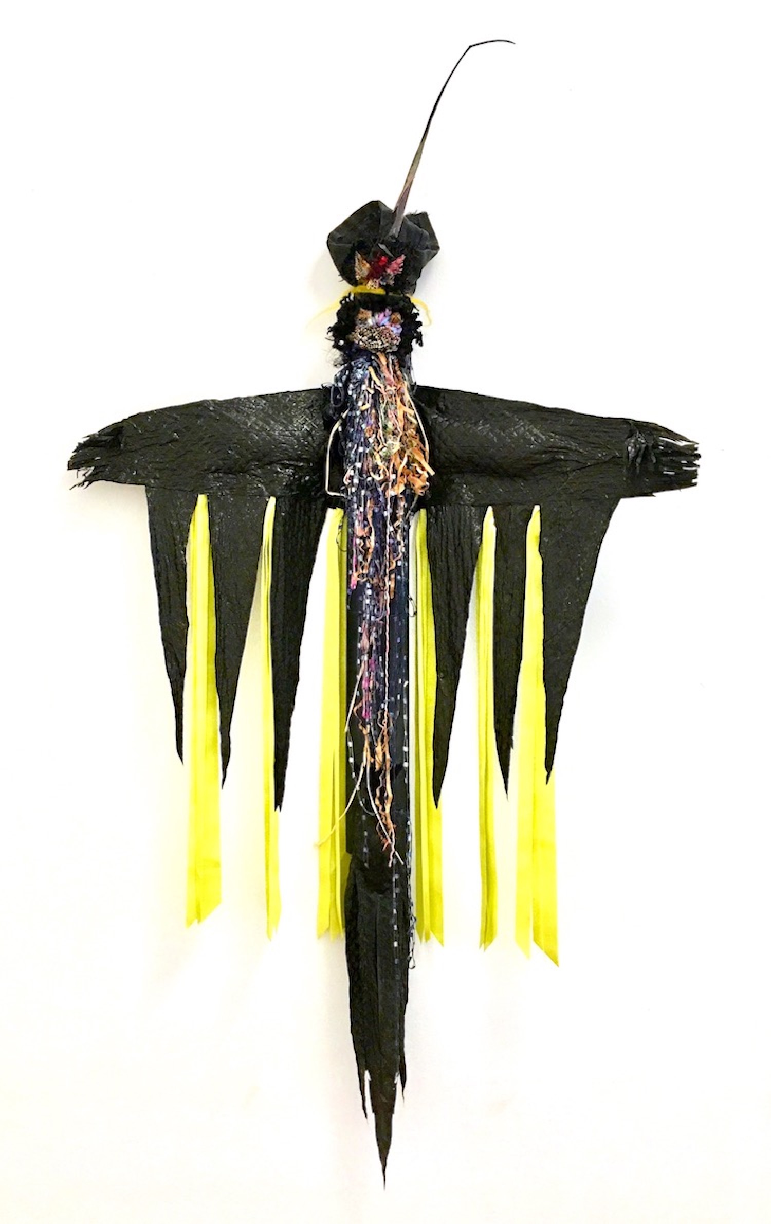 Village Guardian Black plastic bag, textiles, ribbon, felt, threads, rusty bell, cotton batting, fibers, found objects on cardboard 40 x 24 x 4” 2019