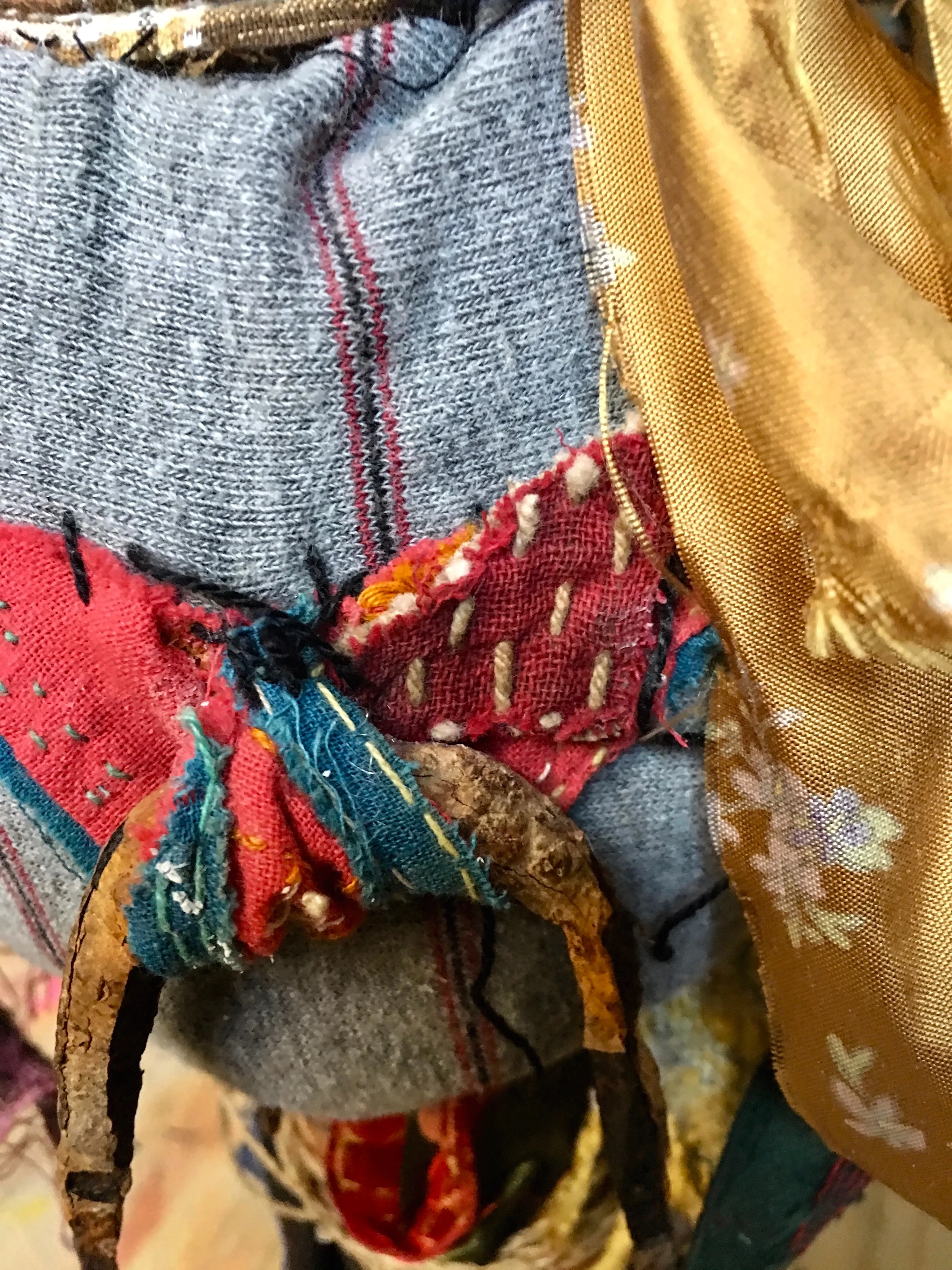 Tall Hat (Detail) Textile, rust, cord, antique India fabric, scraps from Bosnia and Japan, plastic, foil, paper, ribbon, thread, yarn, acrylic on industrial cardboard tube 24½ x 10 x 7½” 2016- 2019
