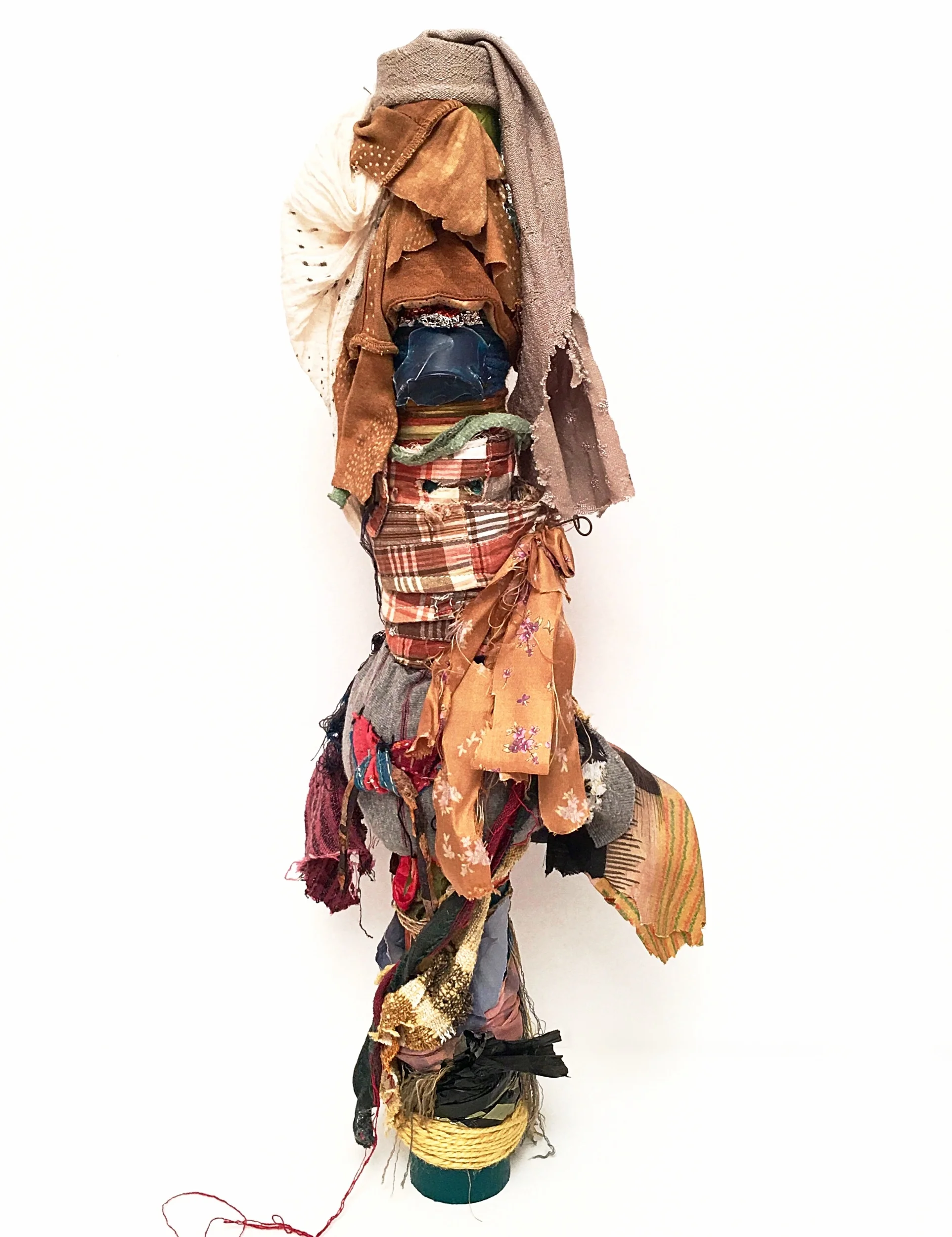 Tall Hat Textile, rust, cord, antique India fabric, scraps from Bosnia and Japan, plastic, foil, paper, ribbon, thread, yarn, acrylic on industrial cardboard tube 24½ x 10 x 7½” 2016-2019
