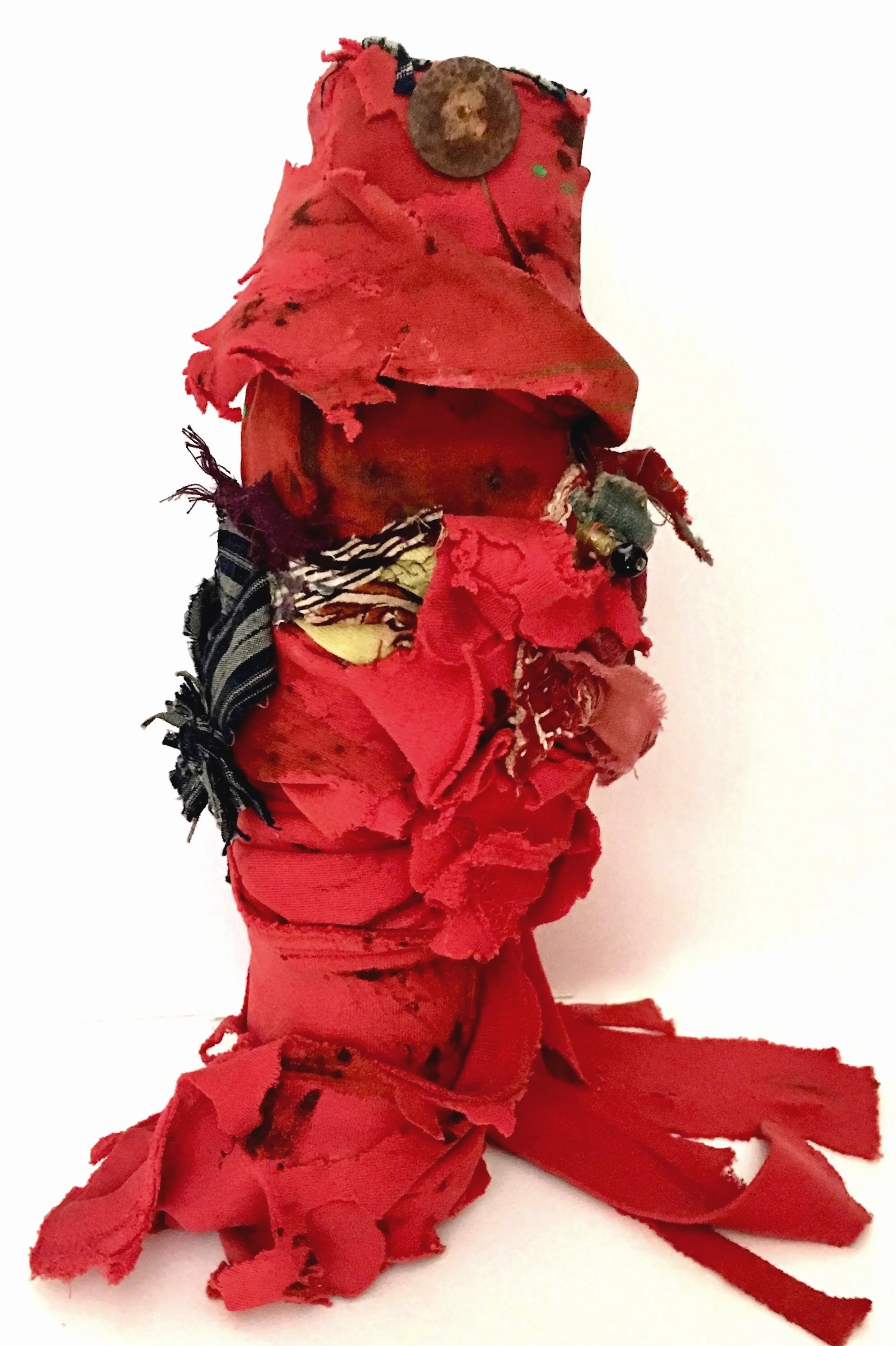 Red Rag Shaker with Amulets Hand-painted red textile, antique Indian textile, buttons, threads, recycled textiles, acrylic on industrial cardboard tube, with hidden power amulets 14 x 8” round 2015