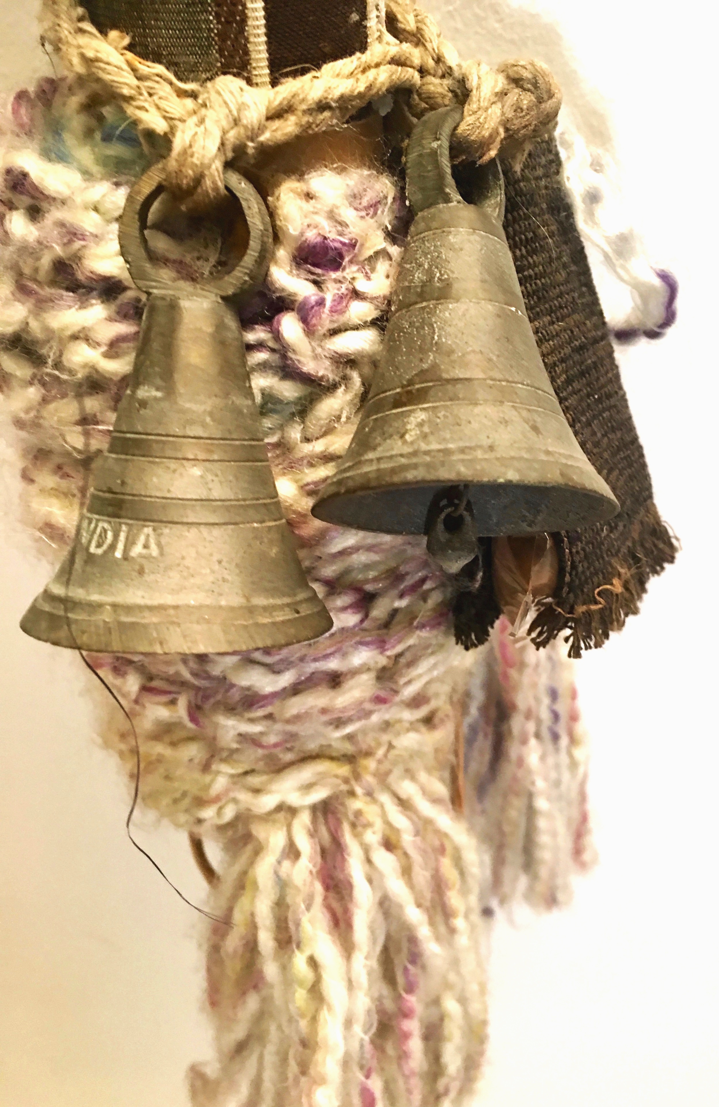 Rhythm Stomp Dancer (Detail) Rusty bells, India bells, textiles, paper, camel tassels from India, cellophane, yarn, cord, acrylic, felt on industrial cardboard 55 x 8” round 2015