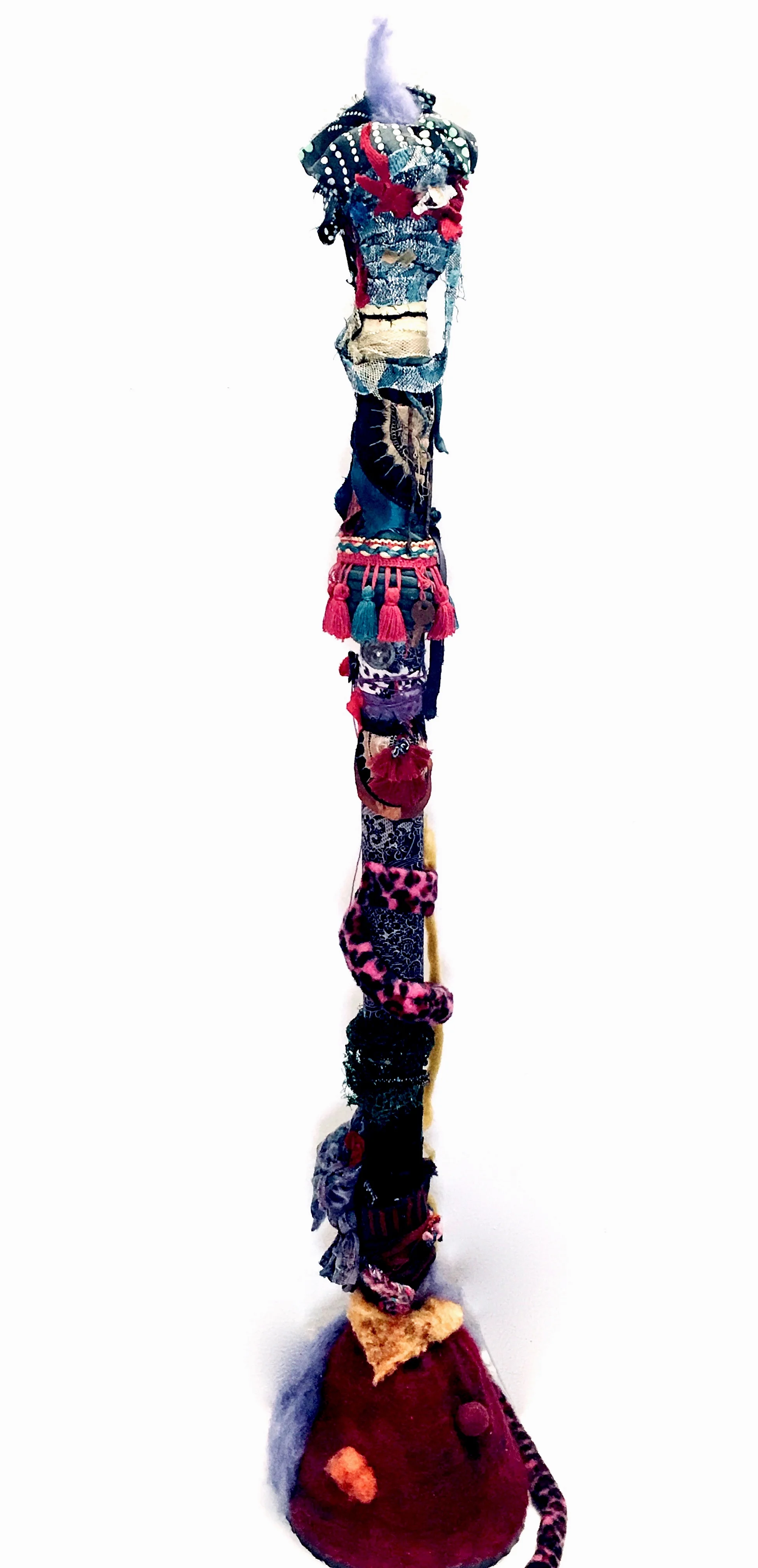 Fancy Felt, ribbon, recycled textiles, mirror, rust, bracelets, costume pieces, gold mesh, plastic mesh, upholstery trim, fiberfill, acrylic on recycled industrial cardboard tube, on ceramic base. 44 x 12 x 12” 2019