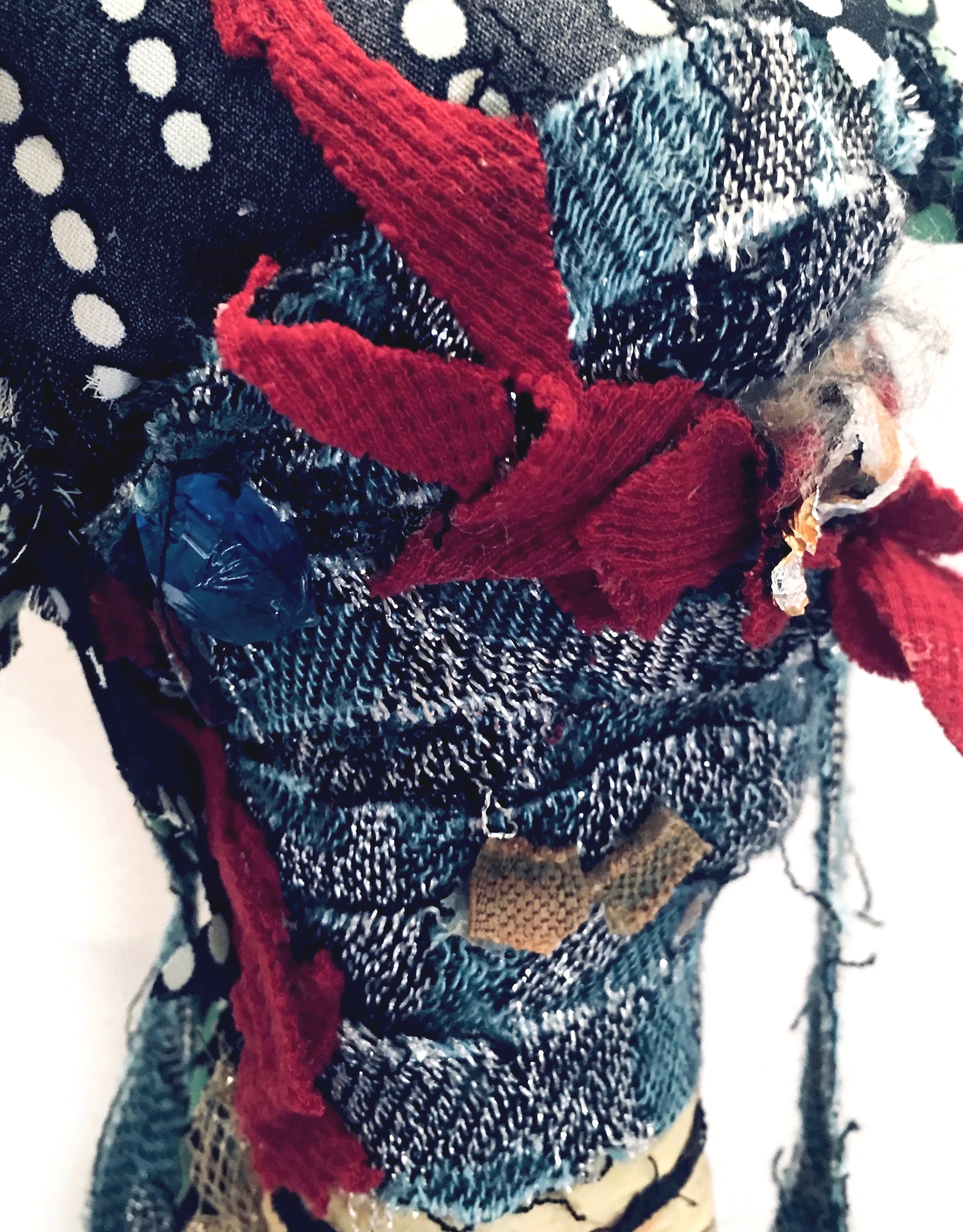 Fancy (Detail) Felt, ribbon, recycled textiles, mirror, rust, bracelets, costume pieces, gold mesh, plastic mesh, upholstery trim, fiberfill, acrylic on recycled industrial cardboard tube, on ceramic base. 44 x 12 x 12” 2019