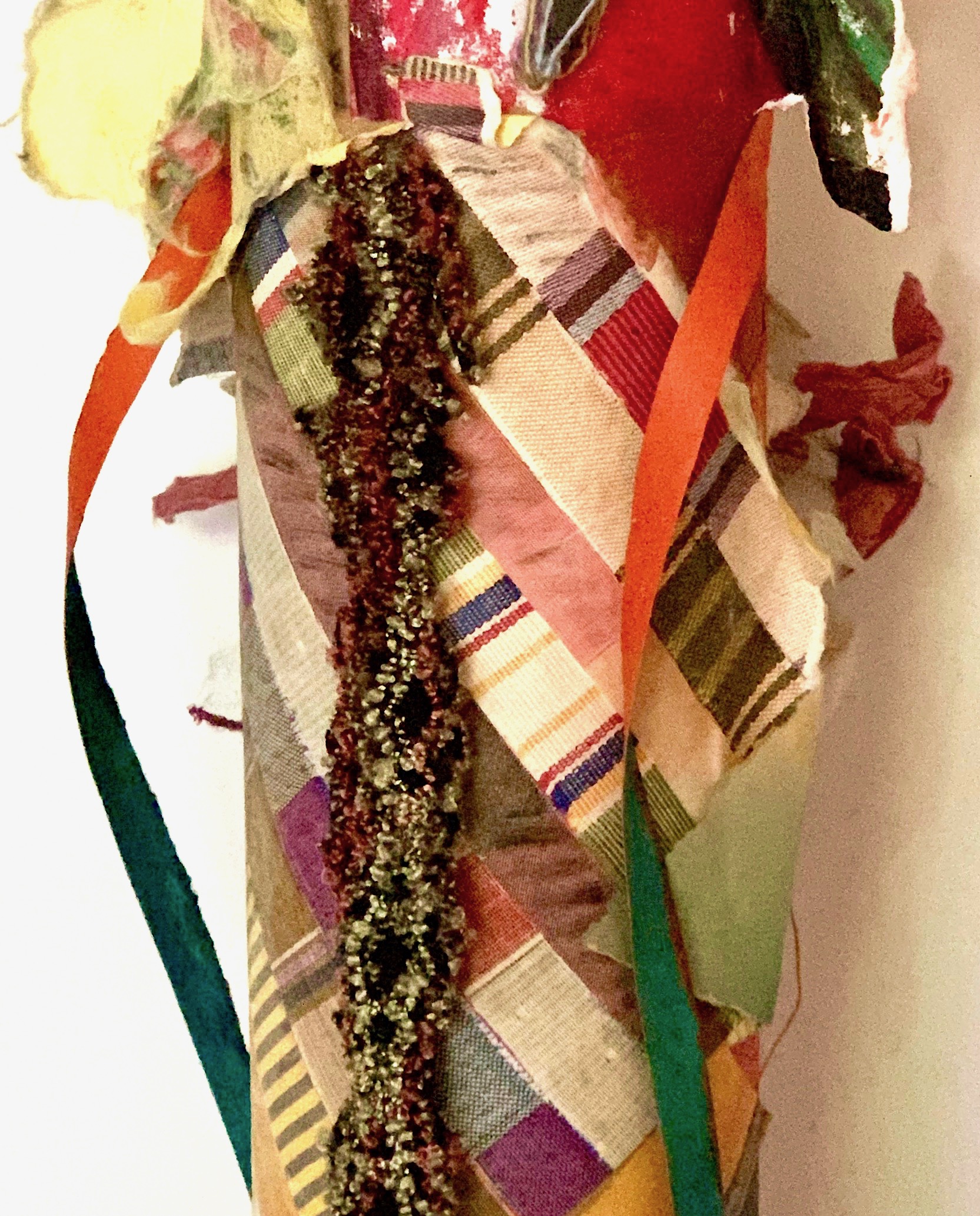 Cool (Detail) Paper from India, Japan, England, hand-colored paper, recycled textiles, felt, wood, stone, rusty sieve, threads, acrylic on industrial cardboard tube 27½ x 8” round 2017