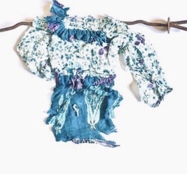 Little Lost Girl Ripped, distressed recycled textile from India, hand stitching and threads on rusty rebar, 10 x 15½ x 1” 2016