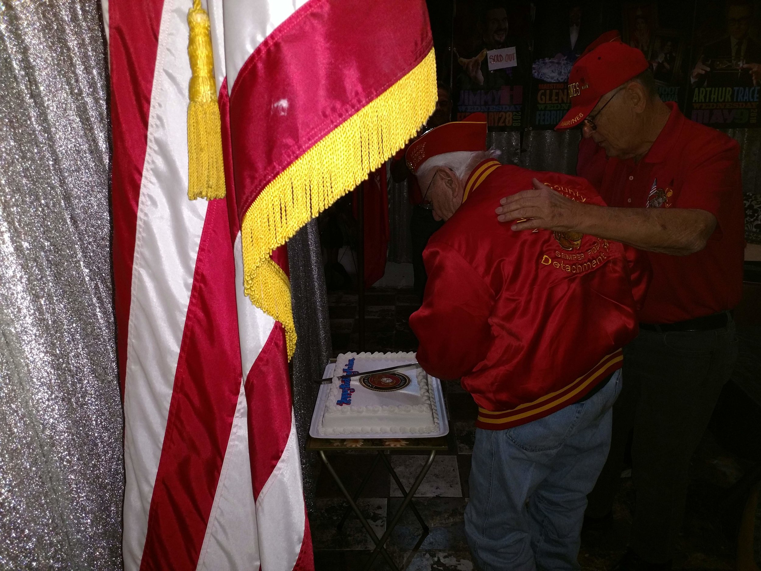 November 10, 2018 Ben Pfister assisting 86 year old Marine, Bob Obrymski, in cutting the Birthday Cake.