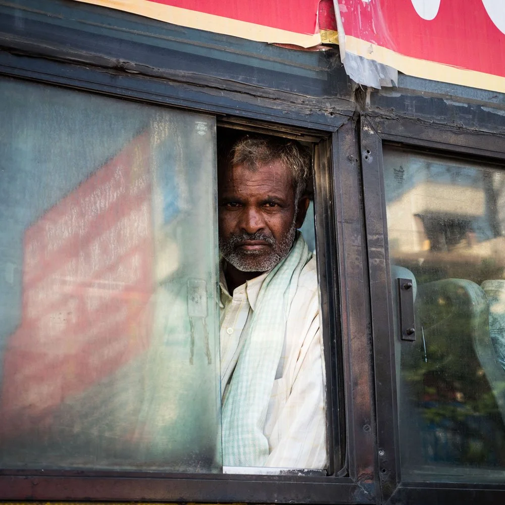 India man on bus square feature.jpg