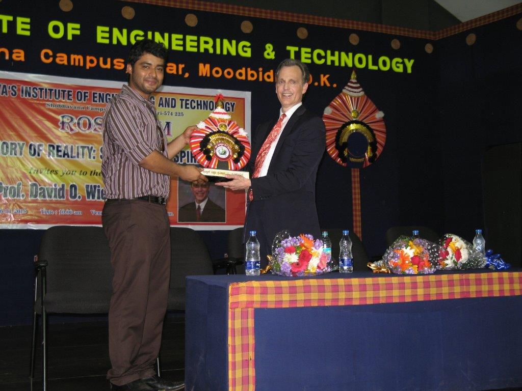 David Wiebers, M.D., accepting an award from Alva College and Educational Foundation outside of Mangalore, India.