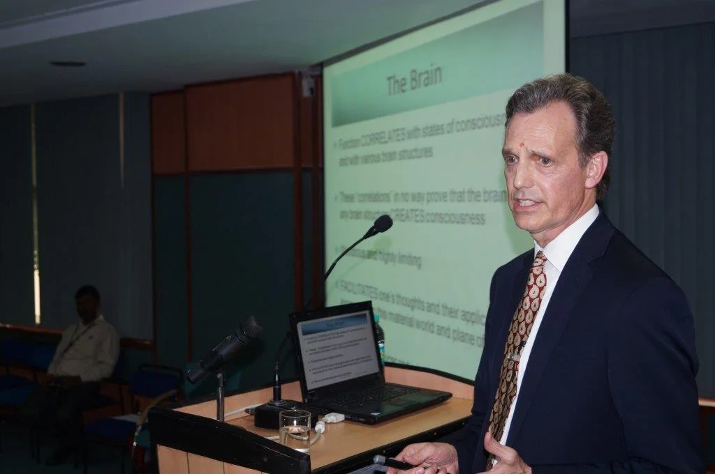 David Wiebers, M.D., delivering Theory of Reality presentation at Amity University Delhi campus on November 9, 2015.