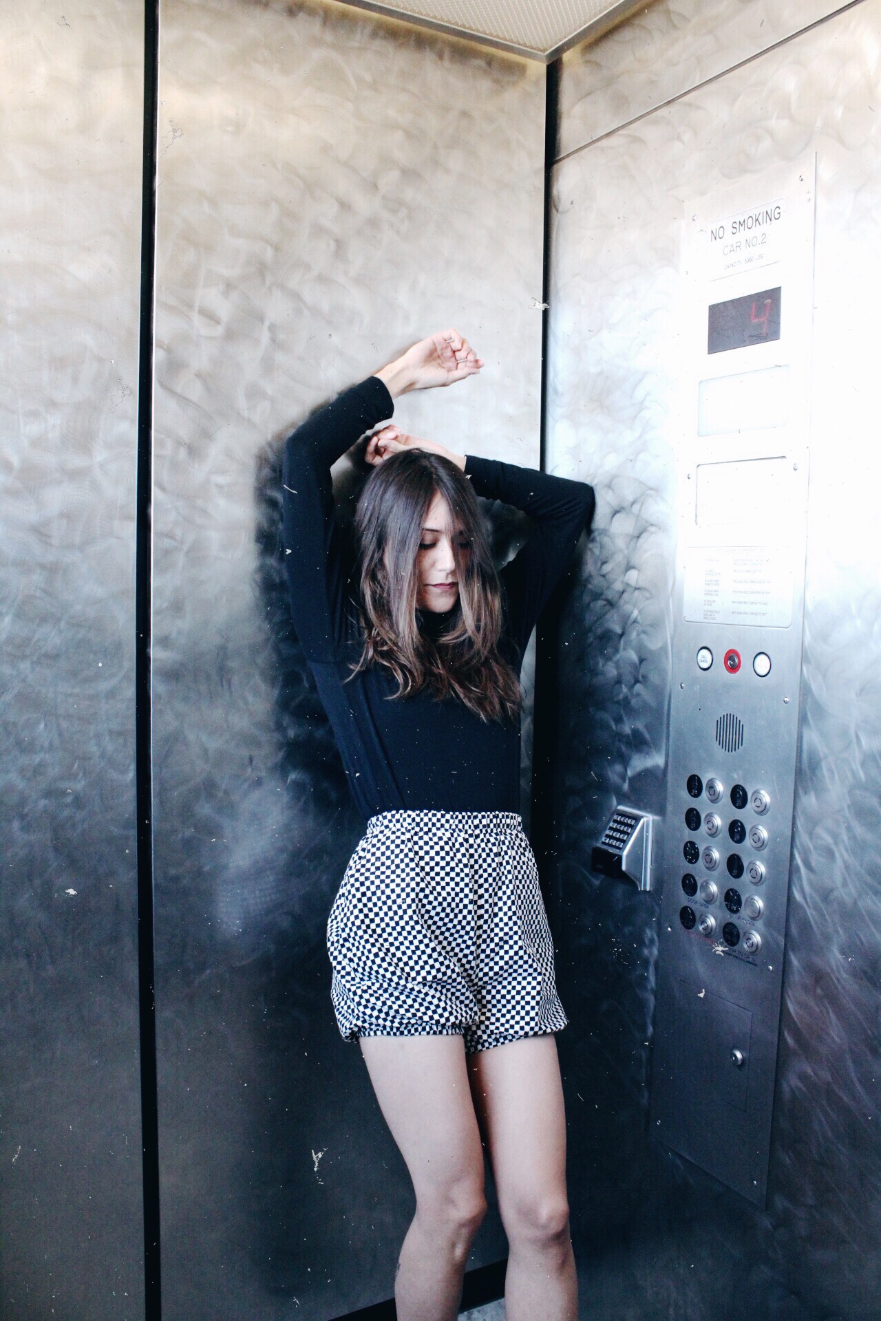Kay wearing vegan fashion checkered shorts by Anastasia Bones