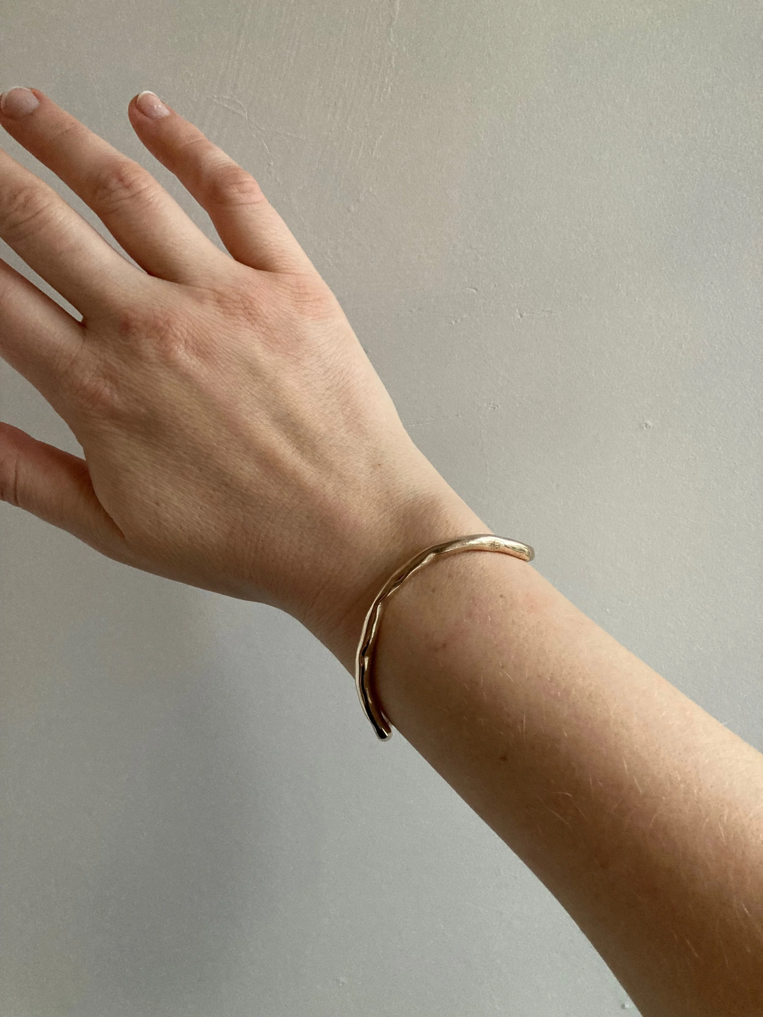 Curve cuff, bronze, top view.jpeg