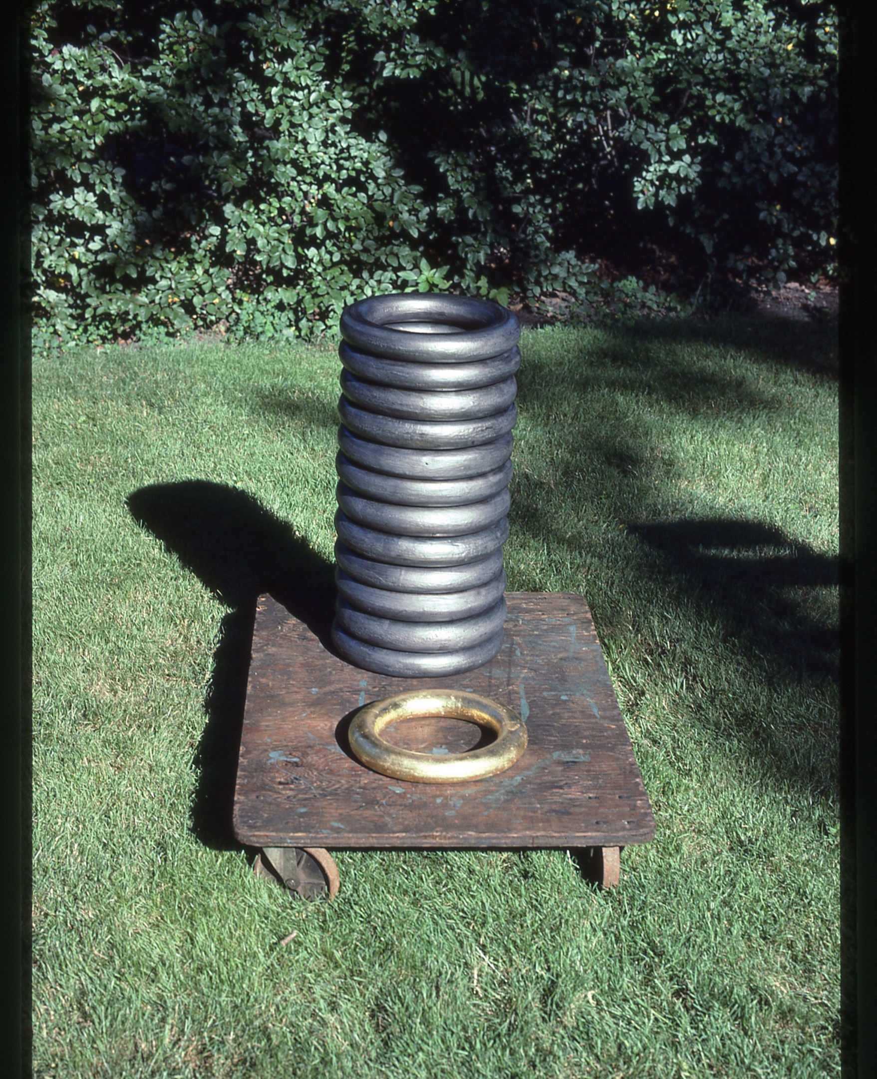 Rings sculpture    graphite  gold leaf on wood base  