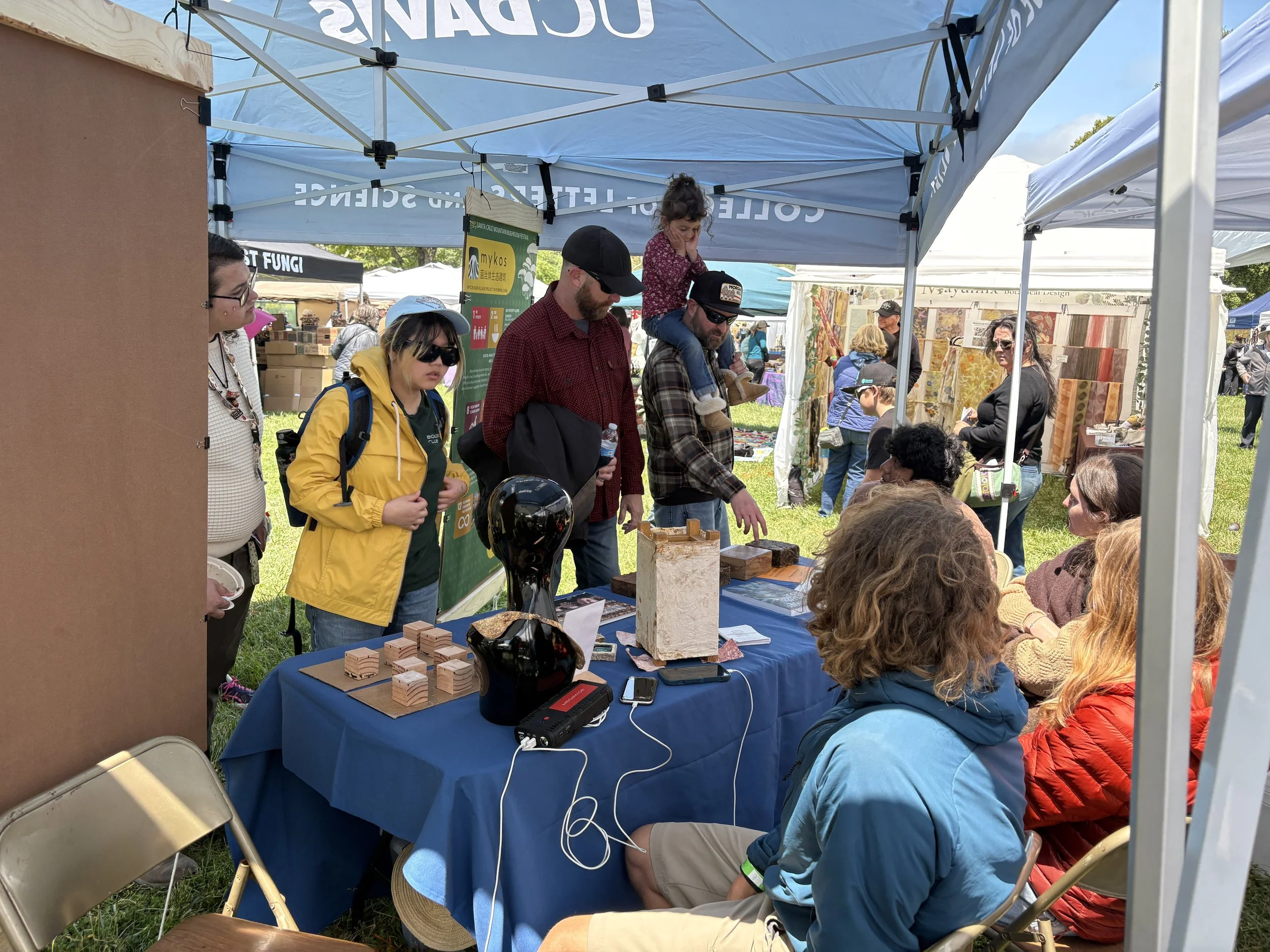 UCD students talking with visitors.JPG