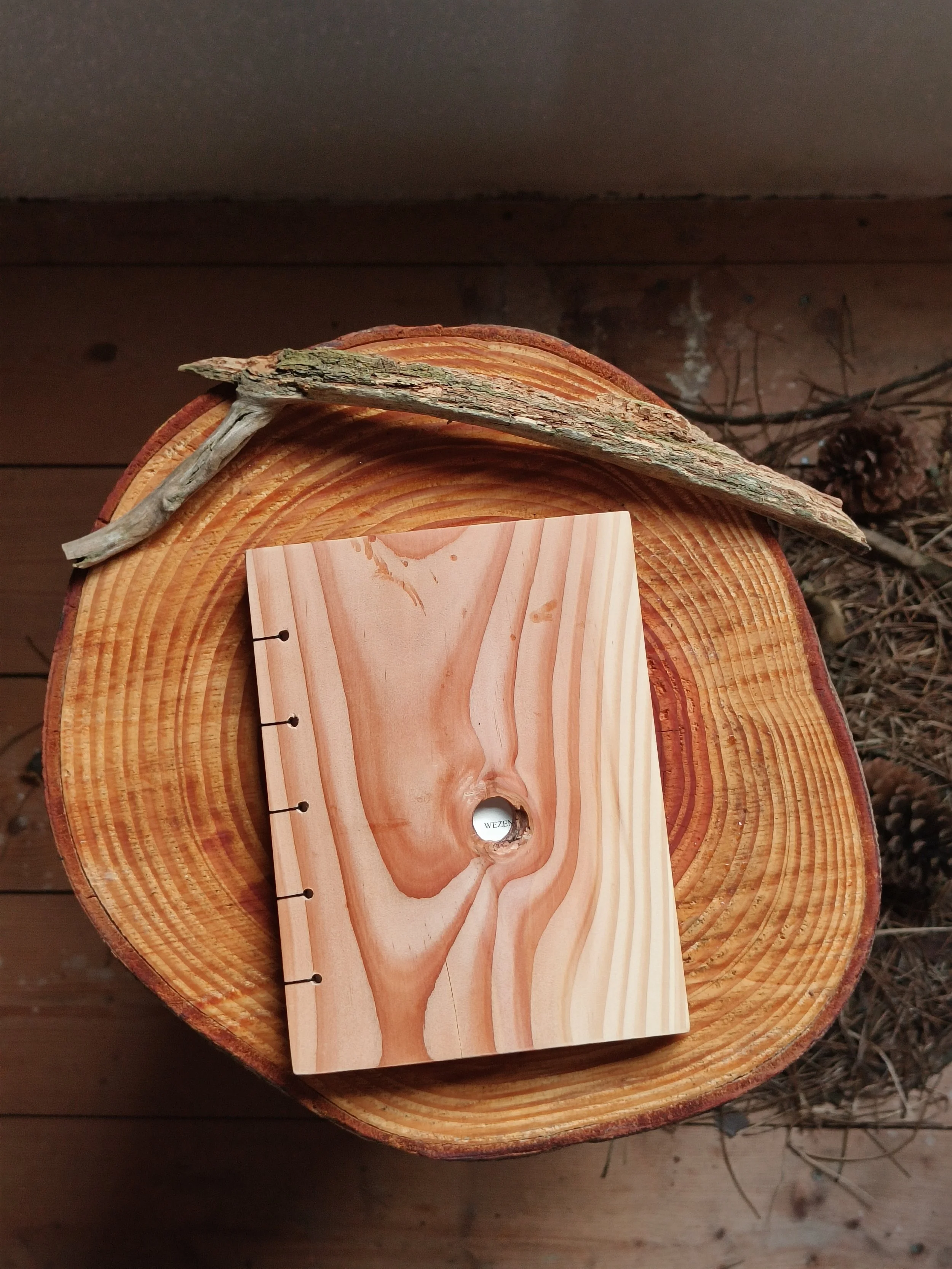  For this challenge, I also created my own poetry bundle—one where all the senses are triggered. I decided to use wood as a hard cover for my bundle, bringing feeling and smell into the reading experience. It also felt right to bring the paper I prin