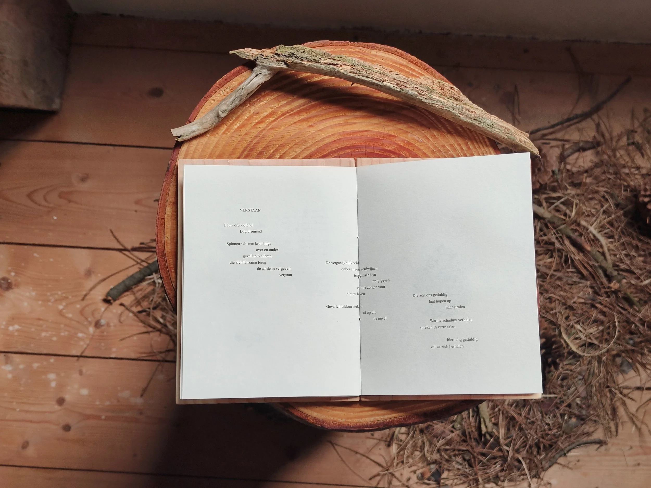  For this challenge, I also created my own poetry bundle—one where all the senses are triggered. I decided to use wood as a hard cover for my bundle, bringing feeling and smell into the reading experience. It also felt right to bring the paper I prin