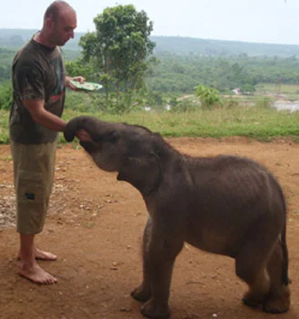 Dr. Christopher Stremme feeding Bona (April, 2011)